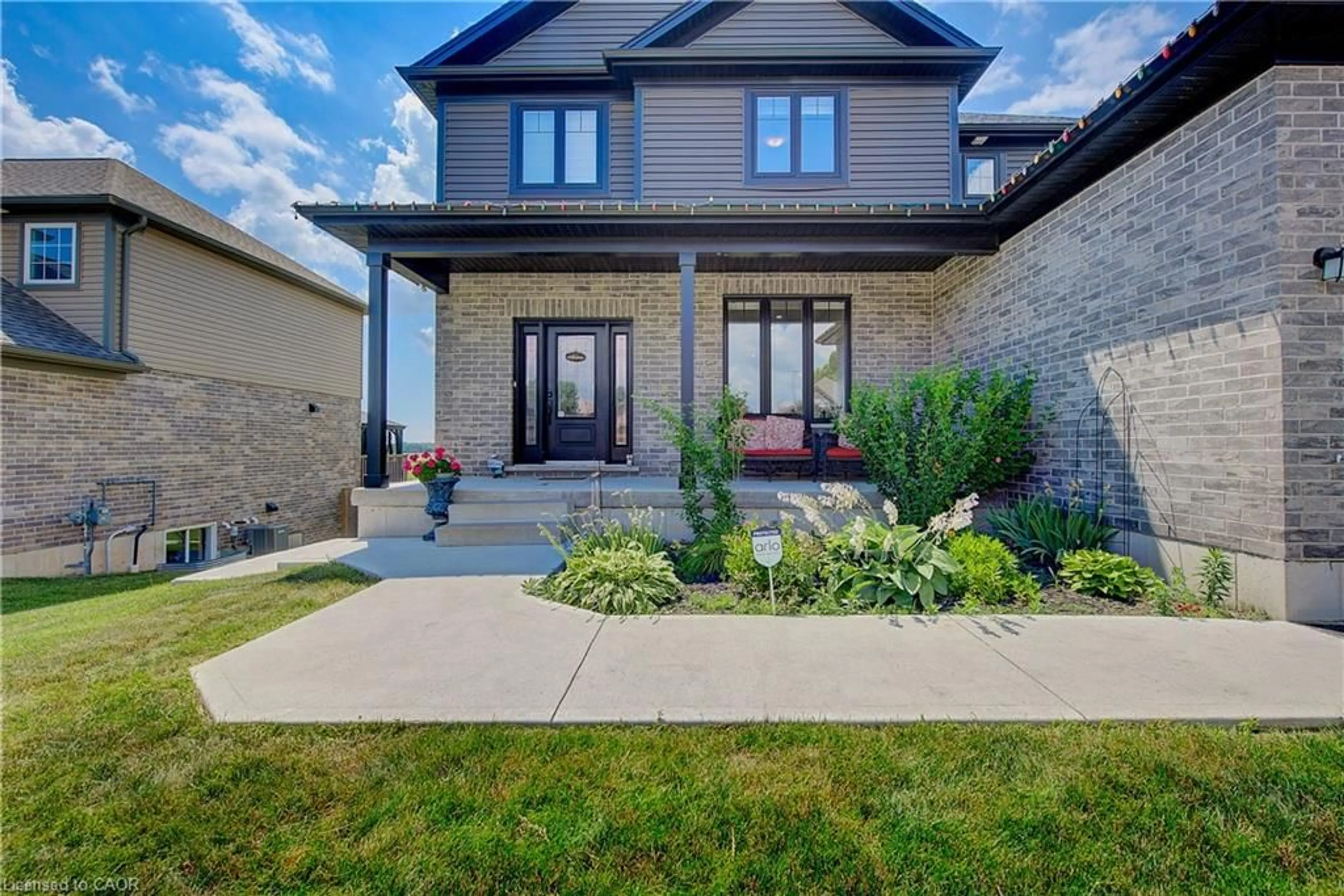 Home with brick exterior material, street for 21 Morning Glory Dr, Tillsonburg Ontario N4G 5S9