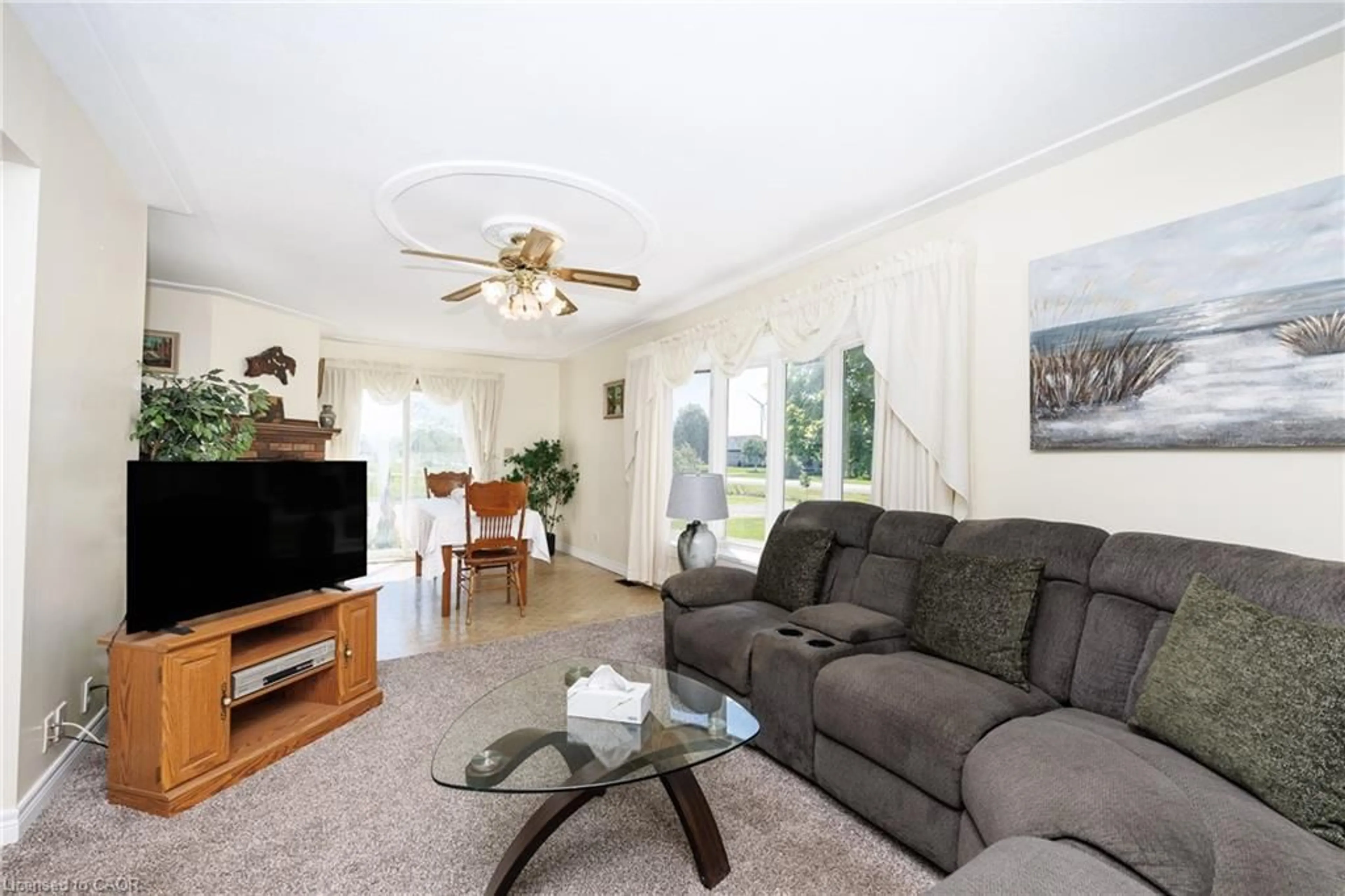 Living room with furniture, wood/laminate floor for 6155 Rainham Rd, Dunnville Ontario N1A 2W8
