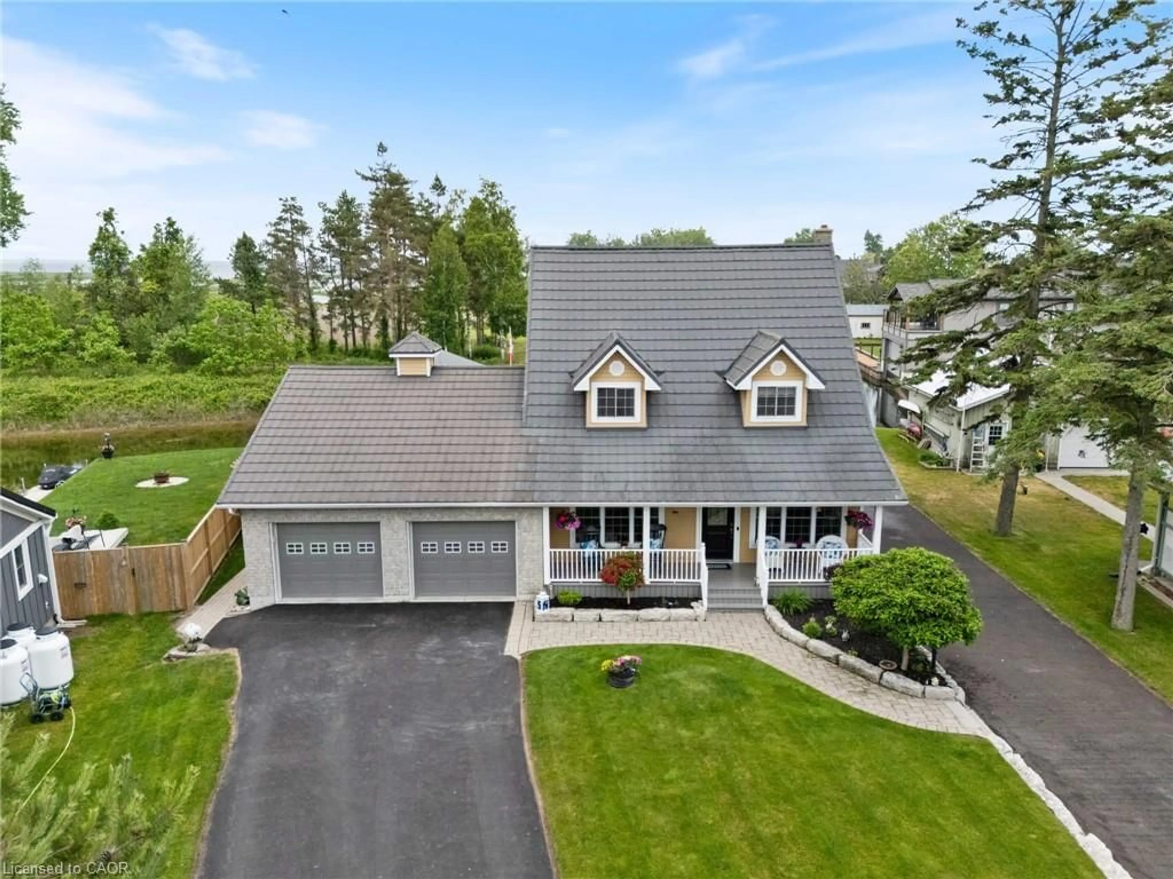 A pic from outside/outdoor area/front of a property/back of a property/a pic from drone, street for 43 Old Cut Blvd, Long Point Ontario N0E 1M0