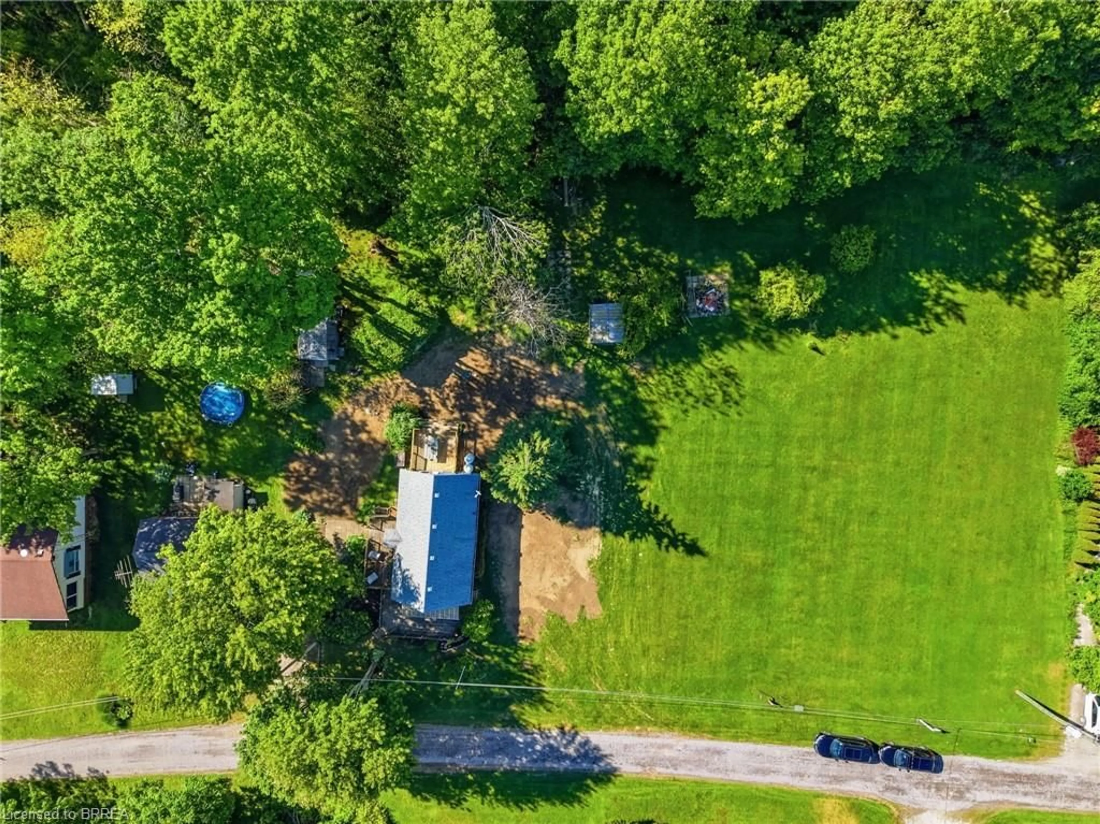 A pic from outside/outdoor area/front of a property/back of a property/a pic from drone, forest/trees view for 525 Avalon Lane, Port Dover Ontario N3Y 4K2