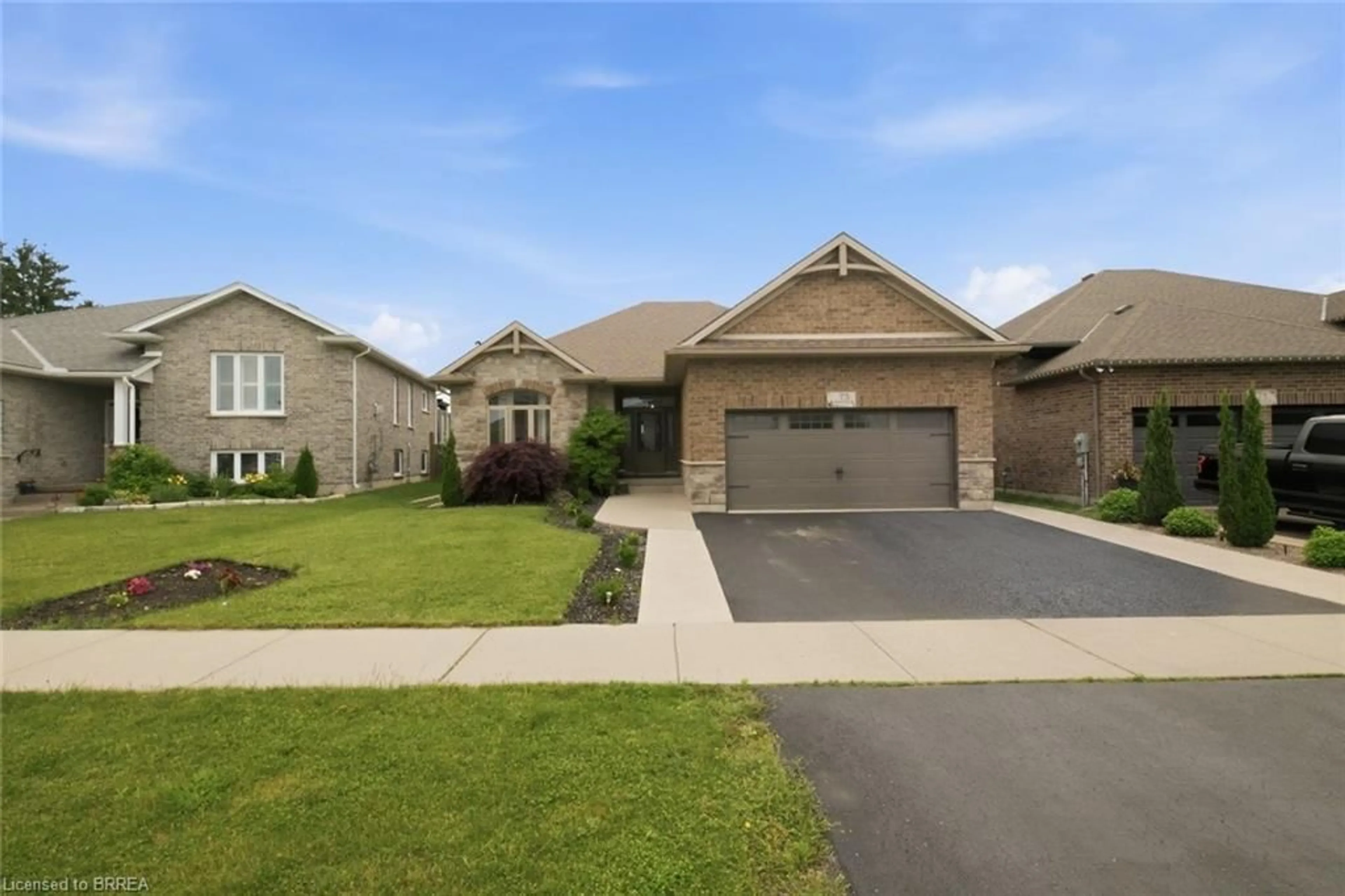 Home with brick exterior material, street for 75 Driftwood Dr, Simcoe Ontario N3Y 0B4