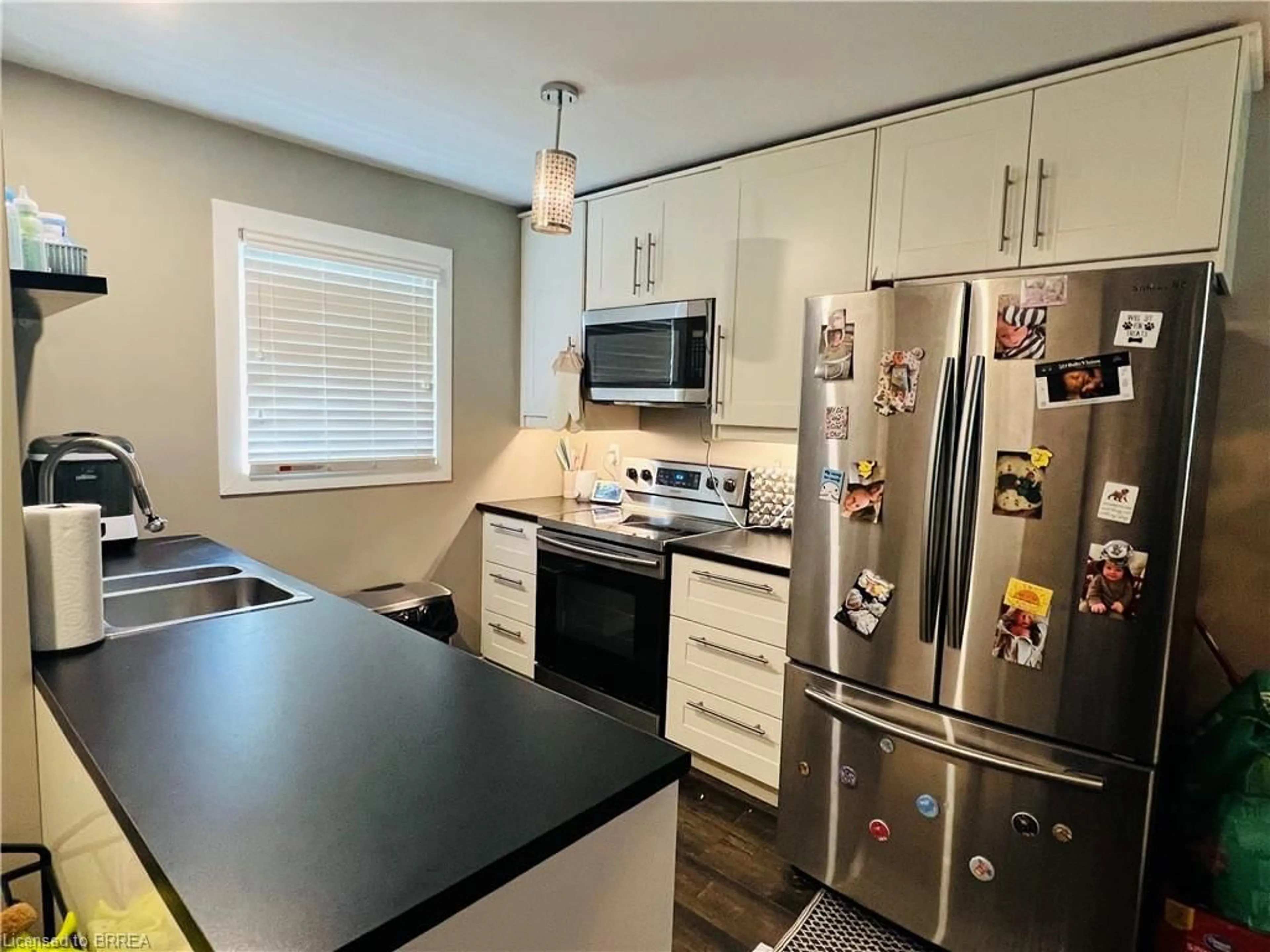 Open concept kitchen, wood/laminate floor for 19 Wren Crt #5, Tillsonburg Ontario N4G 5K2