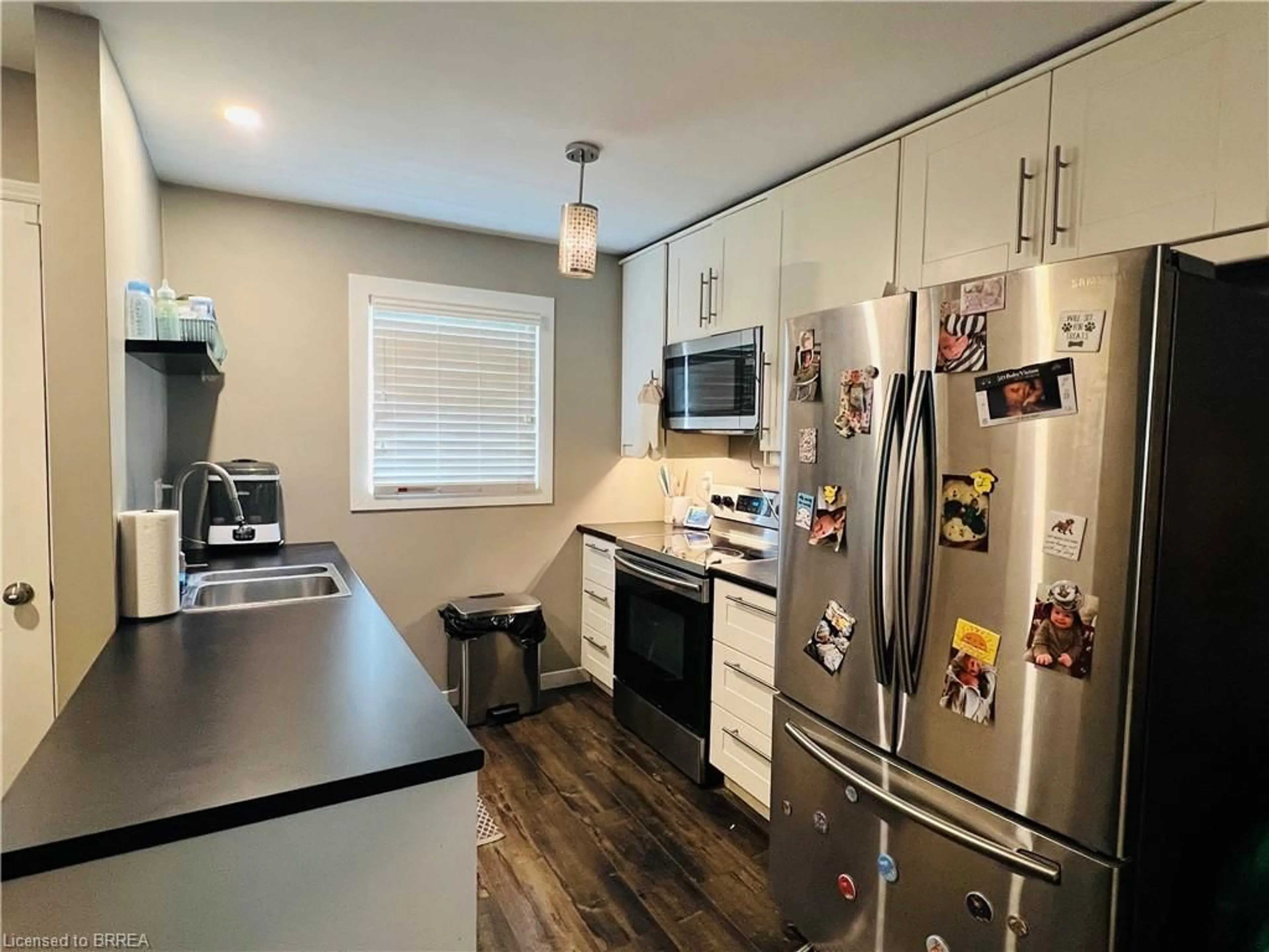 Open concept kitchen, wood/laminate floor for 19 Wren Crt #5, Tillsonburg Ontario N4G 5K2