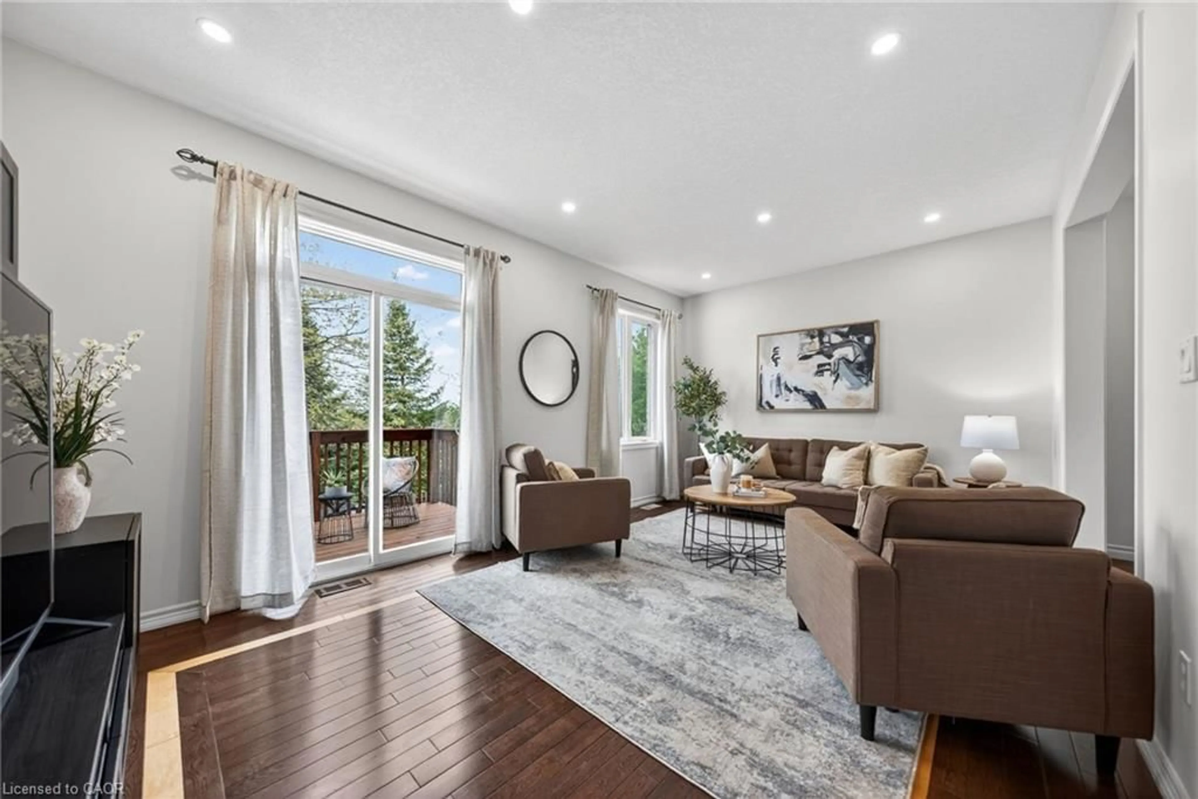 Living room with furniture, wood/laminate floor for 533 Wasaga Cres, Waterloo Ontario N2V 2Y8