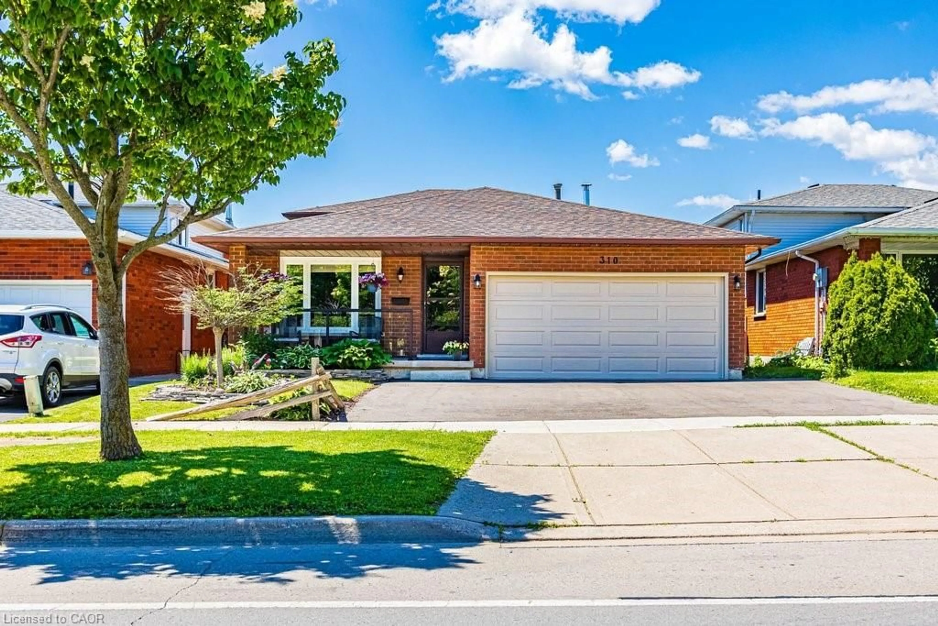 Home with brick exterior material, street for 310 Stone Church Rd, Hamilton Ontario L9B 1B2
