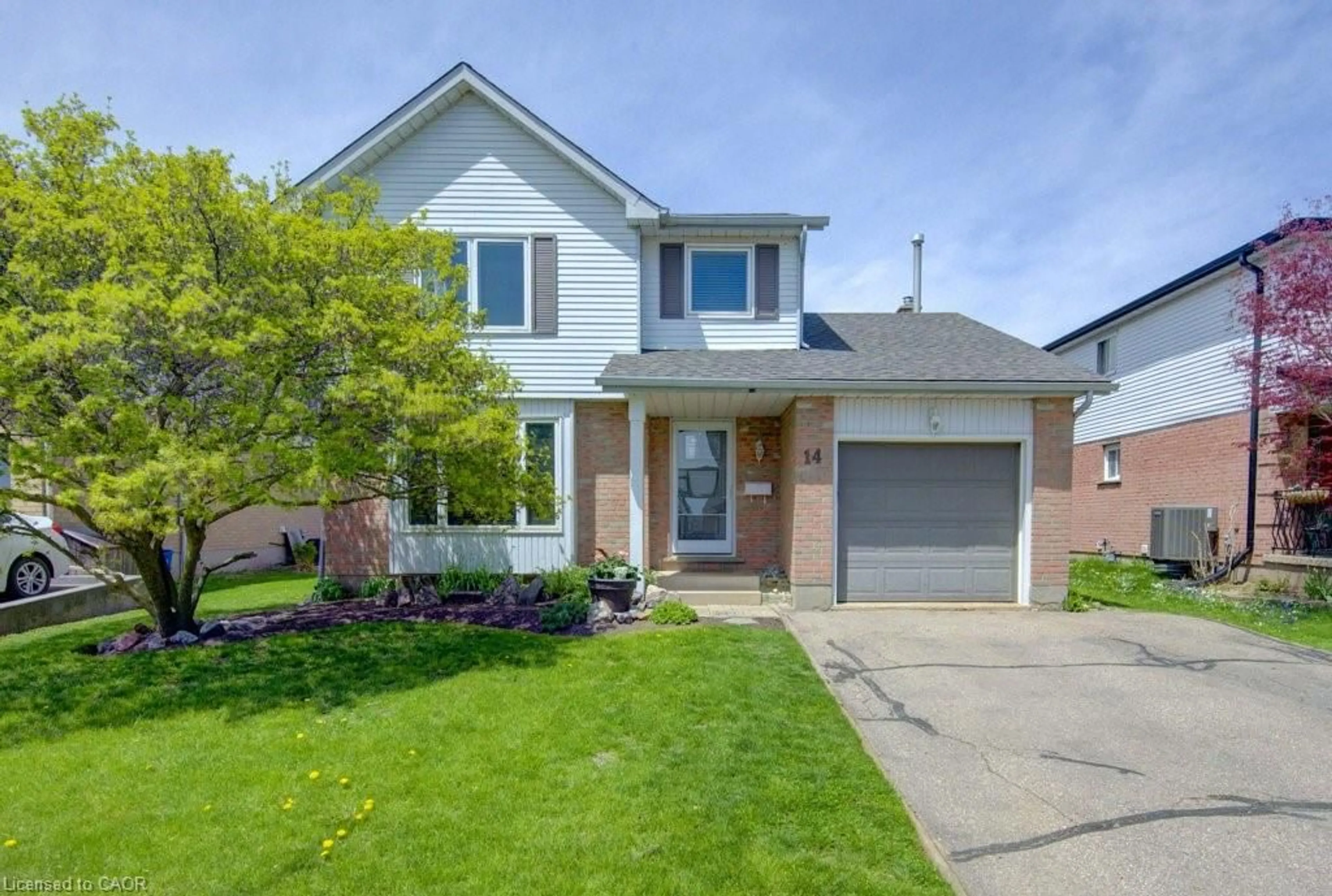 Home with brick exterior material, street for 14 Rose Garden St, Kitchener Ontario N2B 3T1