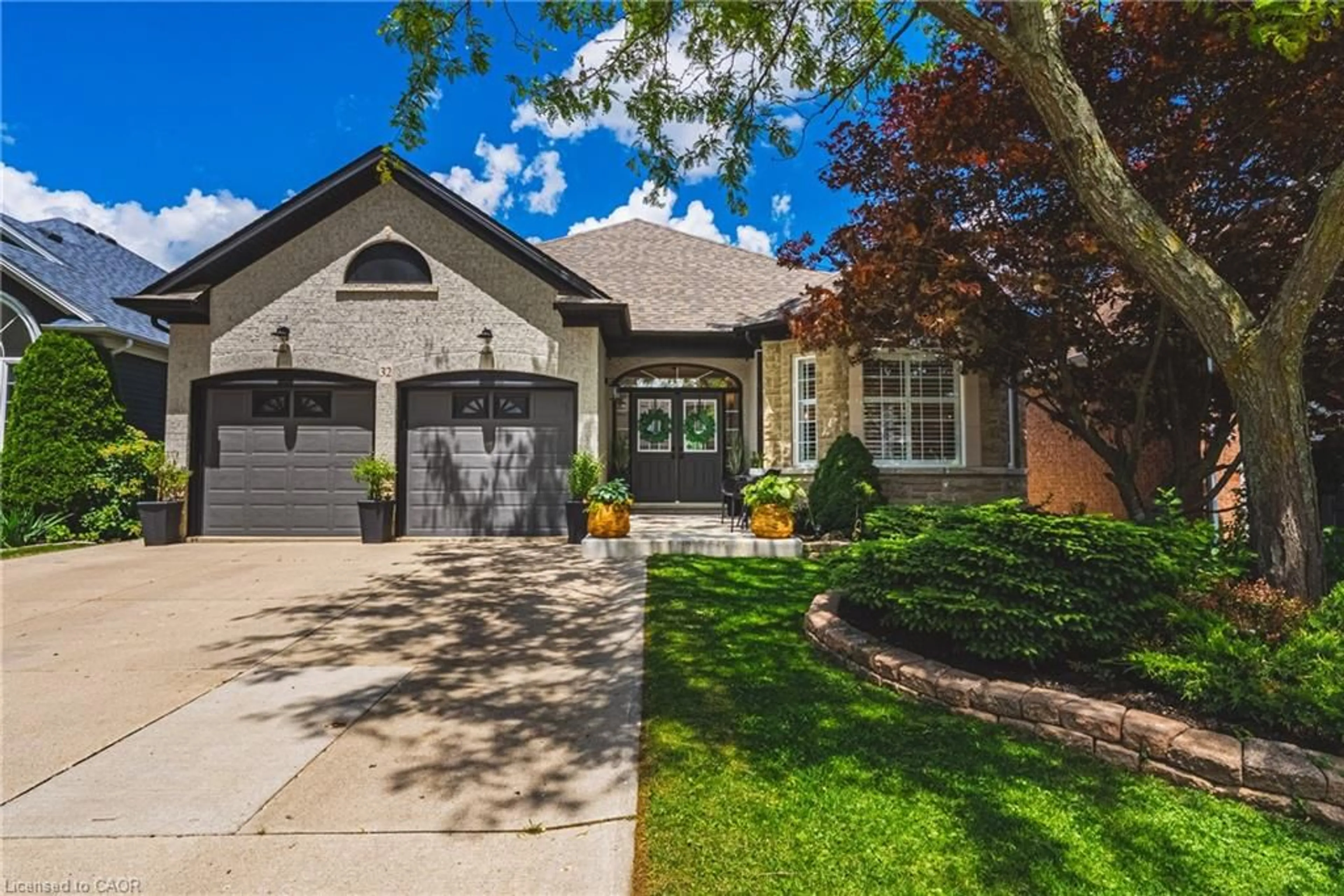 Home with brick exterior material, street for 32 Kopperfield Lane, Mount Hope Ontario L0R 1W0