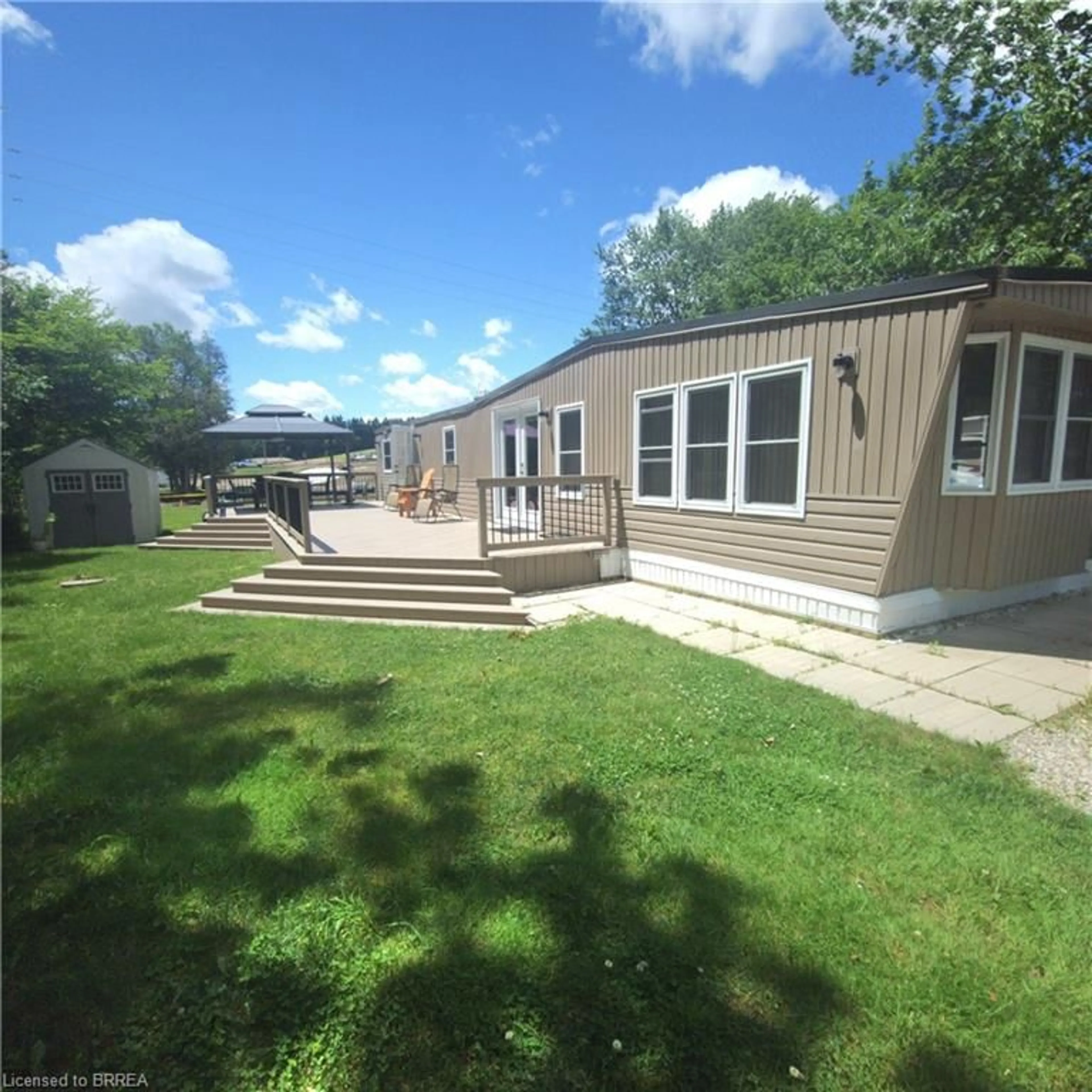 A pic from outside/outdoor area/front of a property/back of a property/a pic from drone, water/lake/river/ocean view for 580 Beaver Creek Rd #Lot 158, Waterloo Ontario N2J 3Z4