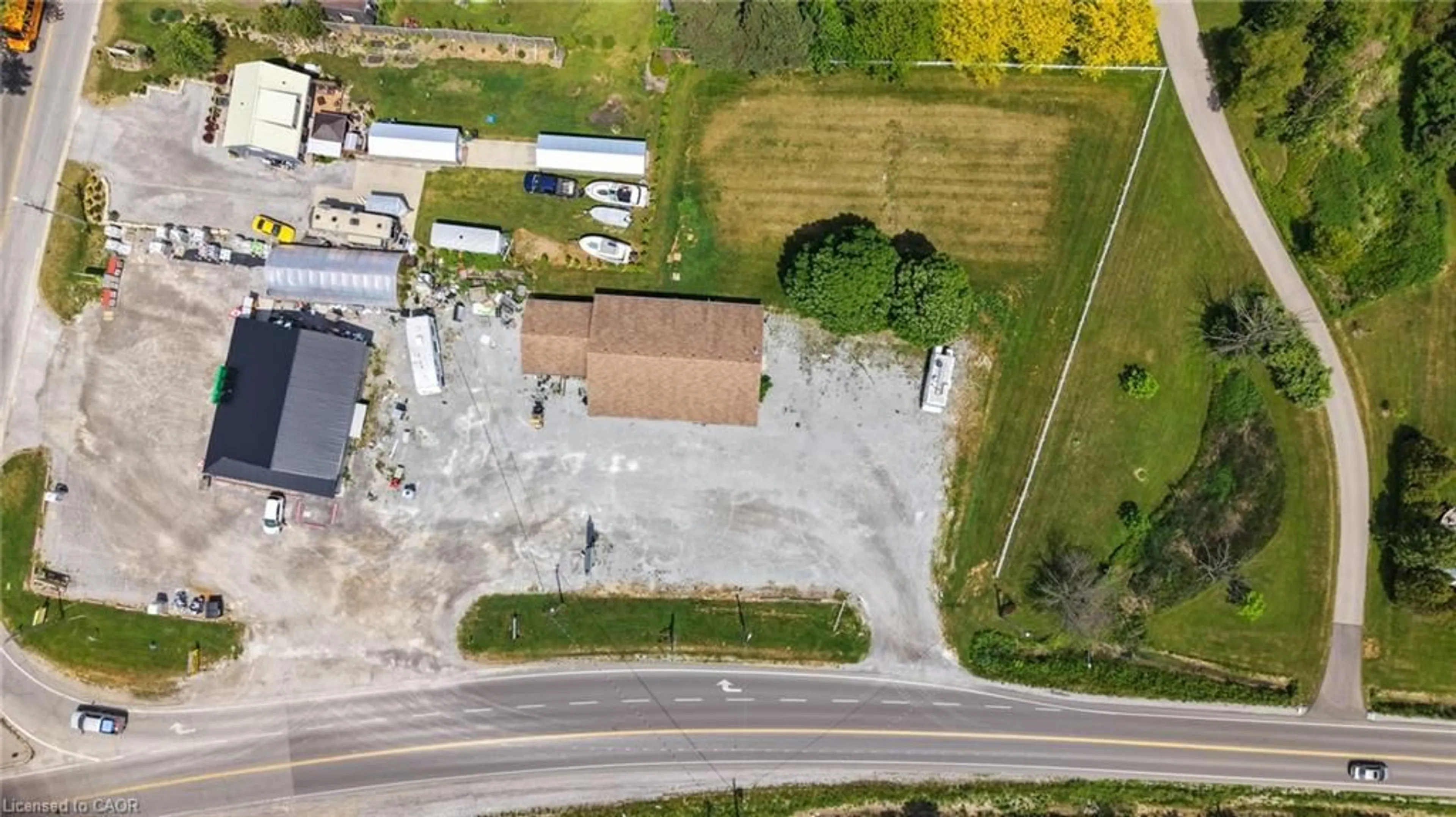 A pic from outside/outdoor area/front of a property/back of a property/a pic from drone, street for 1048 Highway 59, Port Rowan Ontario N0E 1M0
