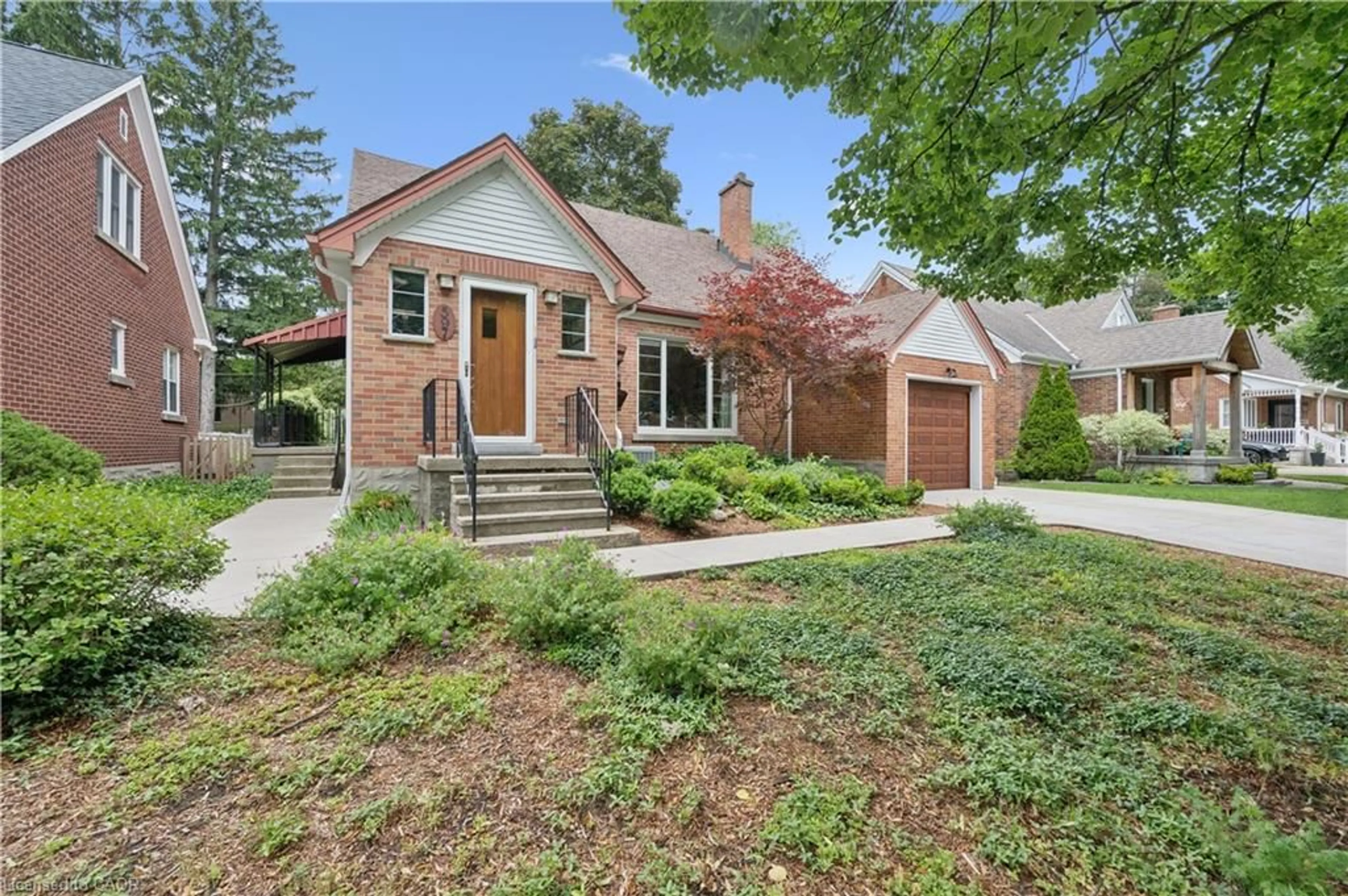 Home with brick exterior material, street for 597 Dunbar Rd, Kitchener Ontario N2M 2X2