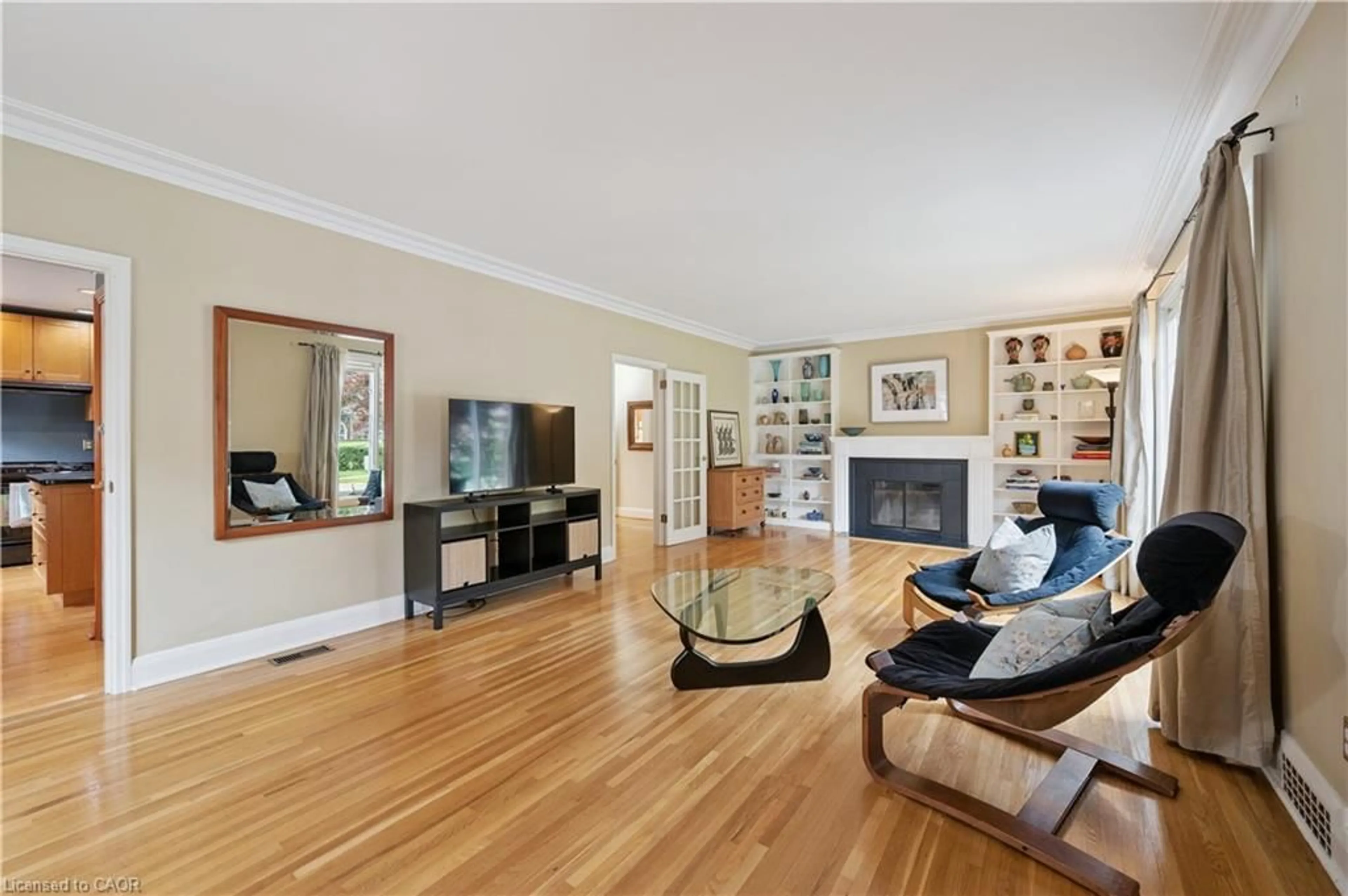 Living room with furniture, wood/laminate floor for 597 Dunbar Rd, Kitchener Ontario N2M 2X2
