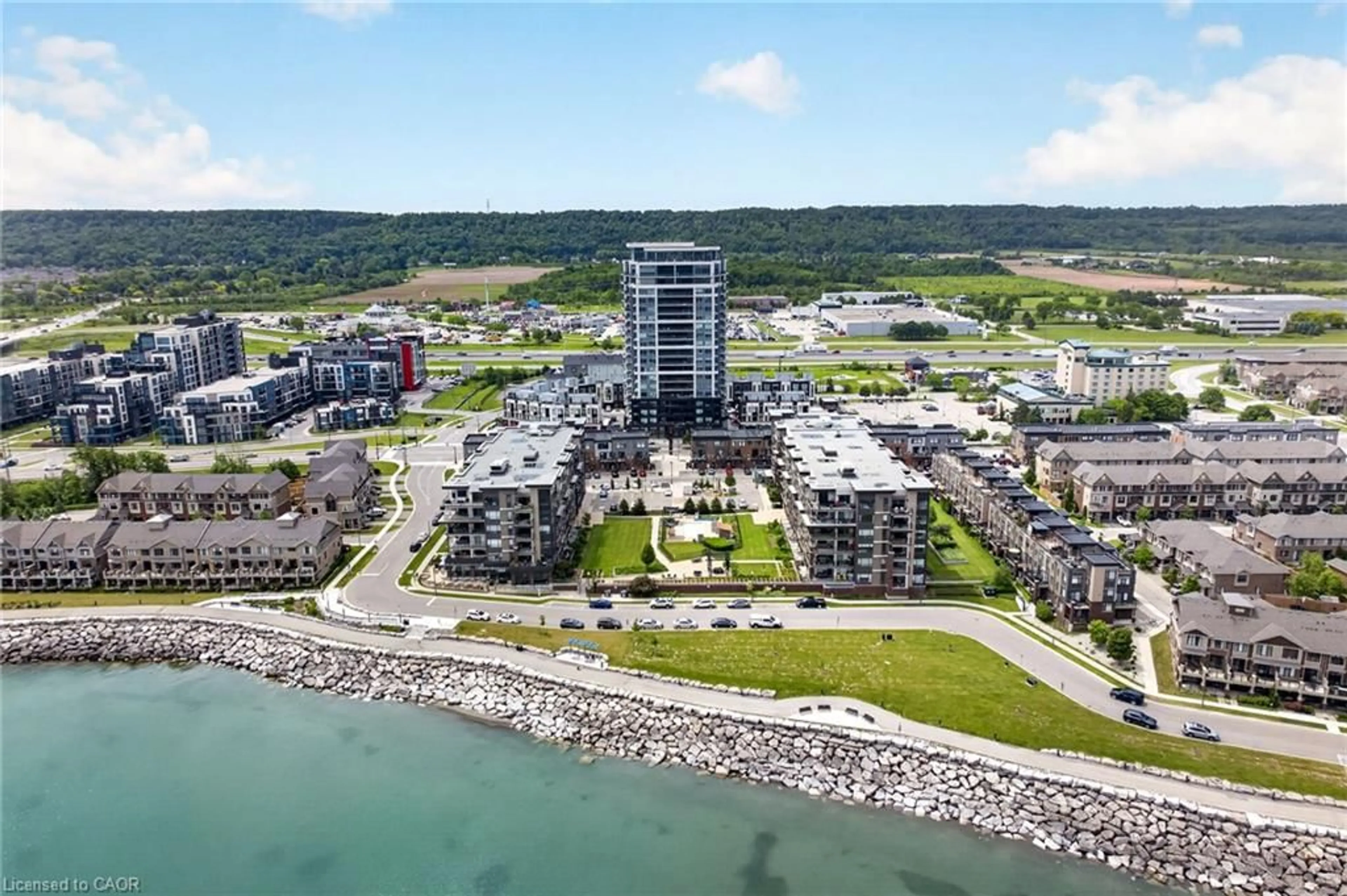A pic from outside/outdoor area/front of a property/back of a property/a pic from drone, water/lake/river/ocean view for 385 Winston Rd #501, Grimsby Ontario L3M 4E8