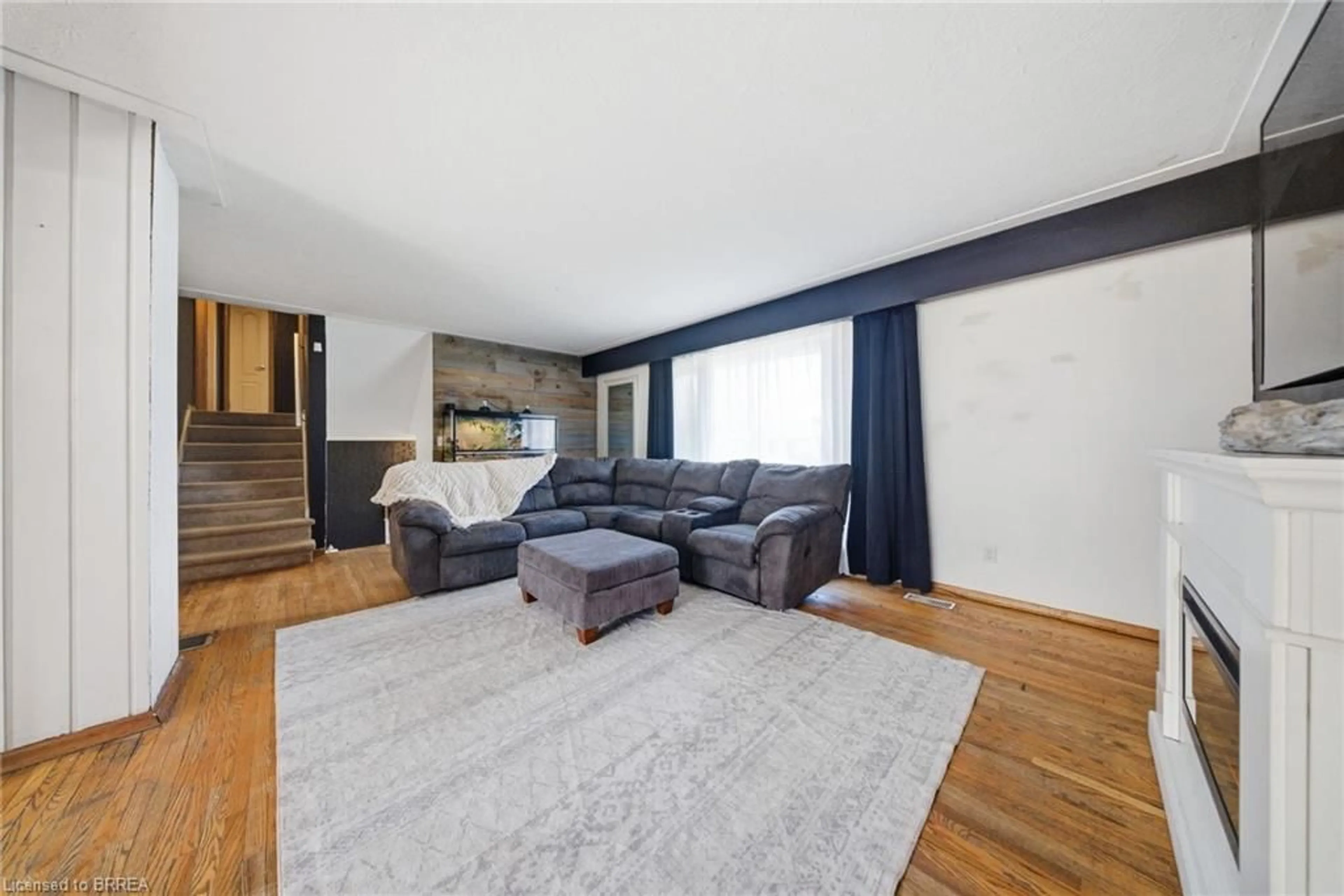 Living room with furniture, wood/laminate floor for 29 Allwood St, Brantford Ontario N3R 2V2