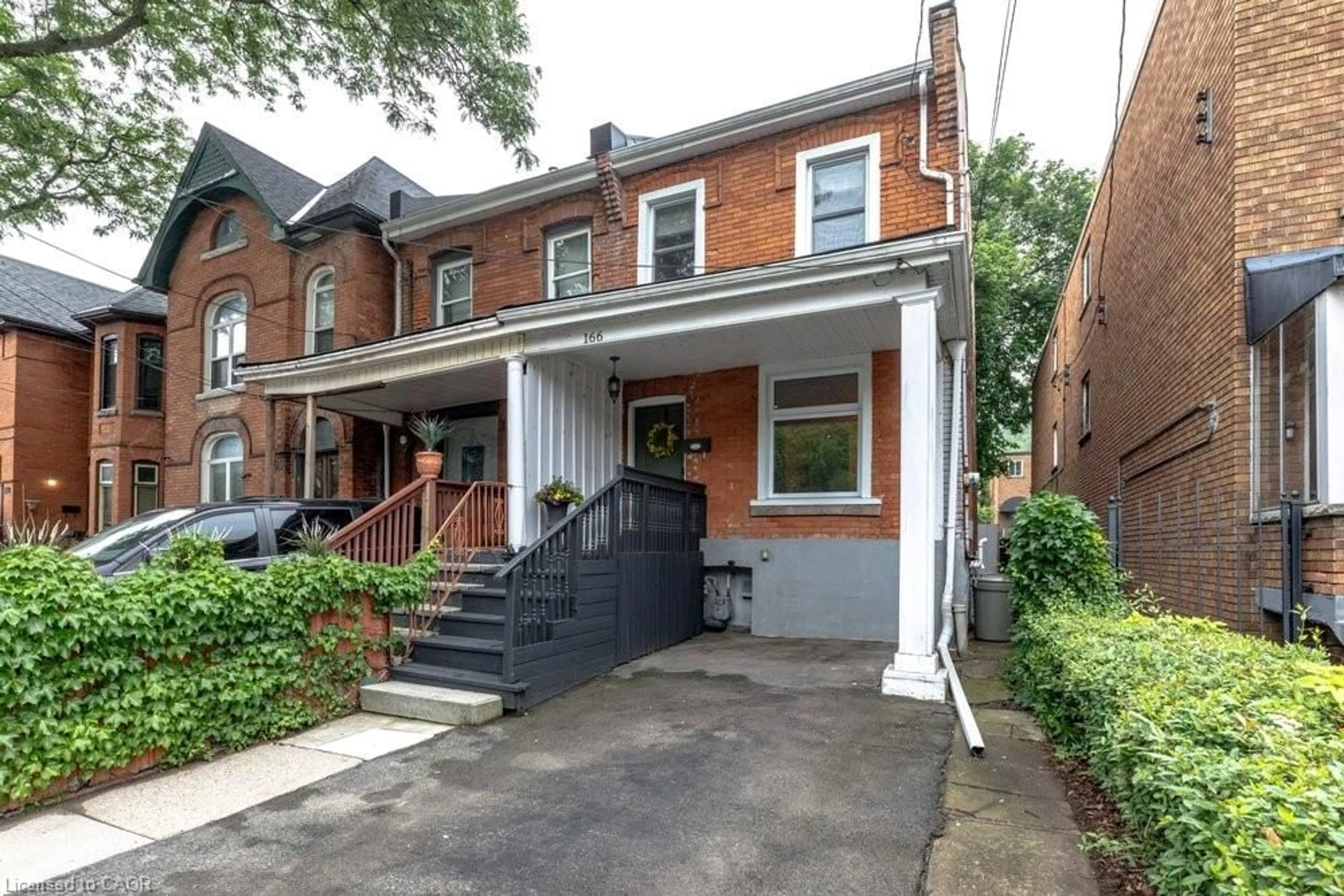 Home with brick exterior material, street for 166 Young St, Hamilton Ontario L8N 1V8