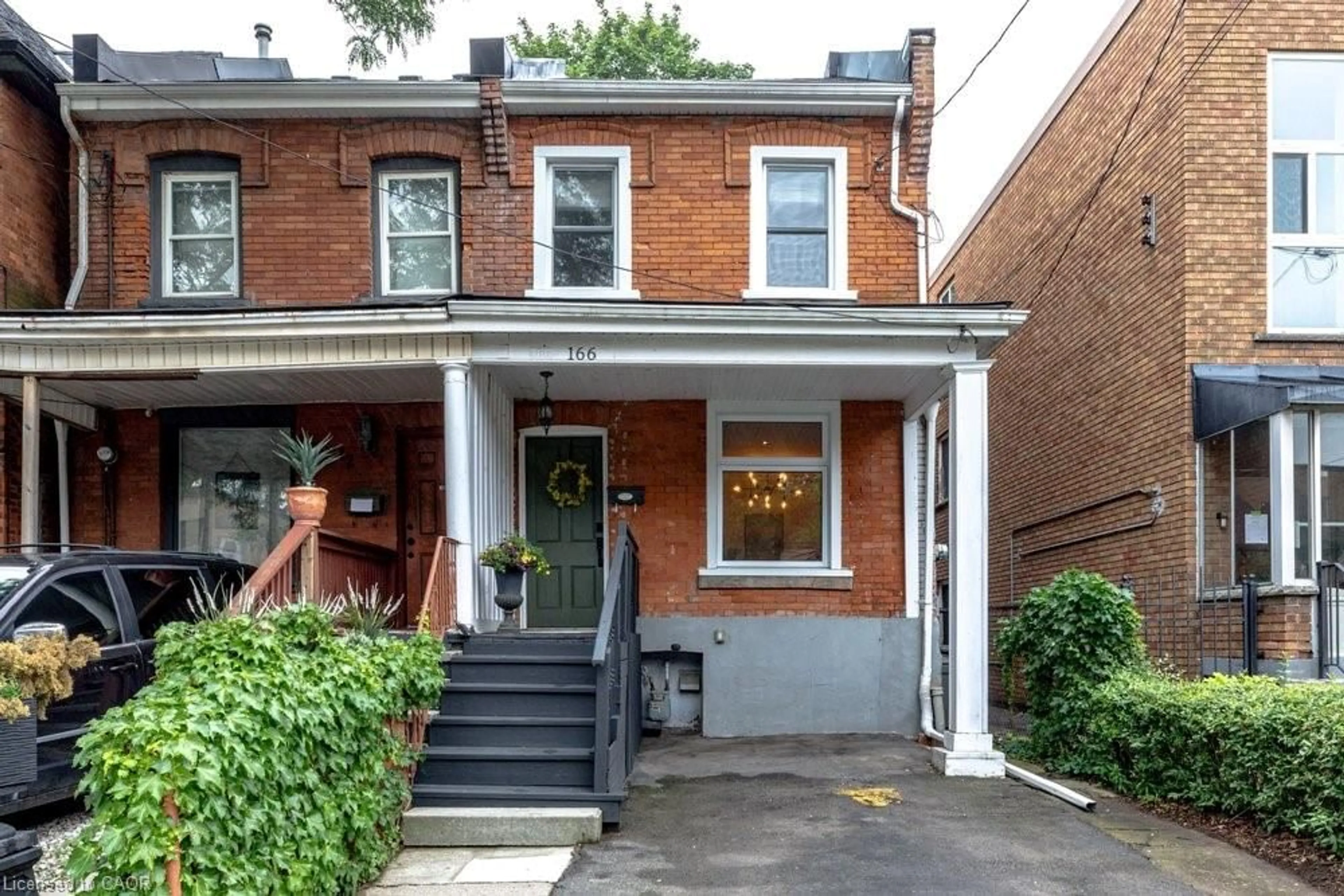 Home with brick exterior material, street for 166 Young St, Hamilton Ontario L8N 1V8