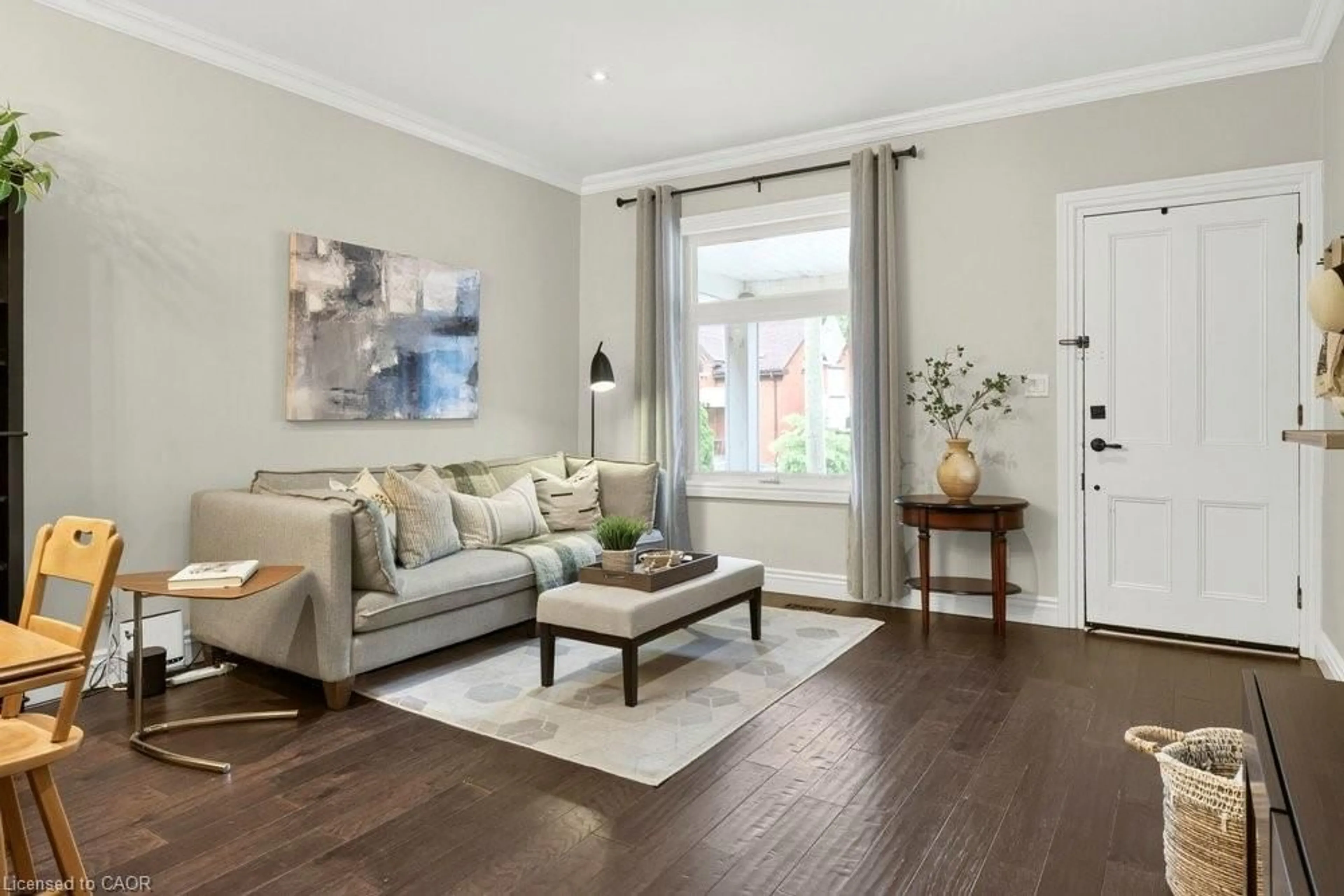 Living room with furniture, wood/laminate floor for 166 Young St, Hamilton Ontario L8N 1V8