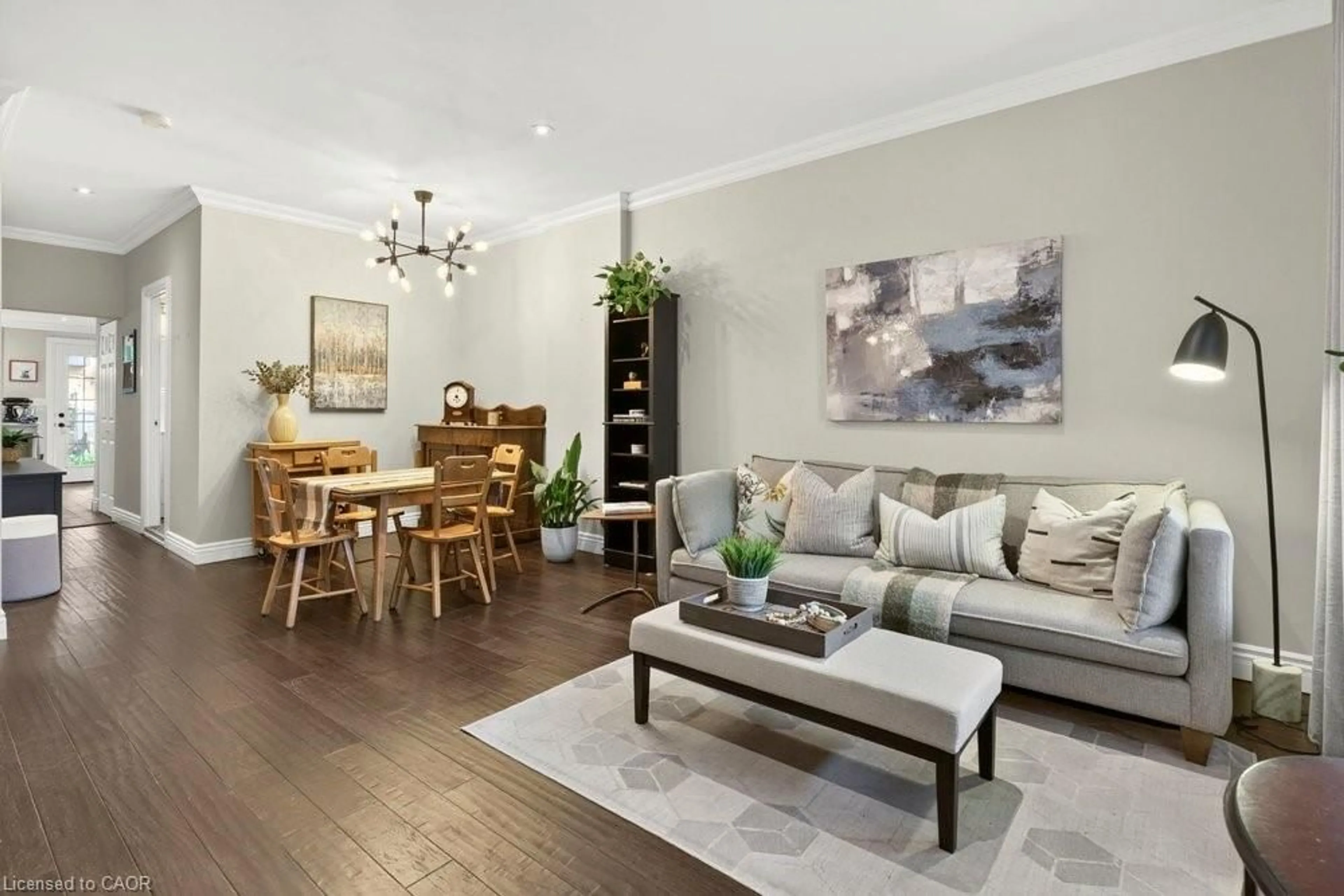 Living room with furniture, wood/laminate floor for 166 Young St, Hamilton Ontario L8N 1V8