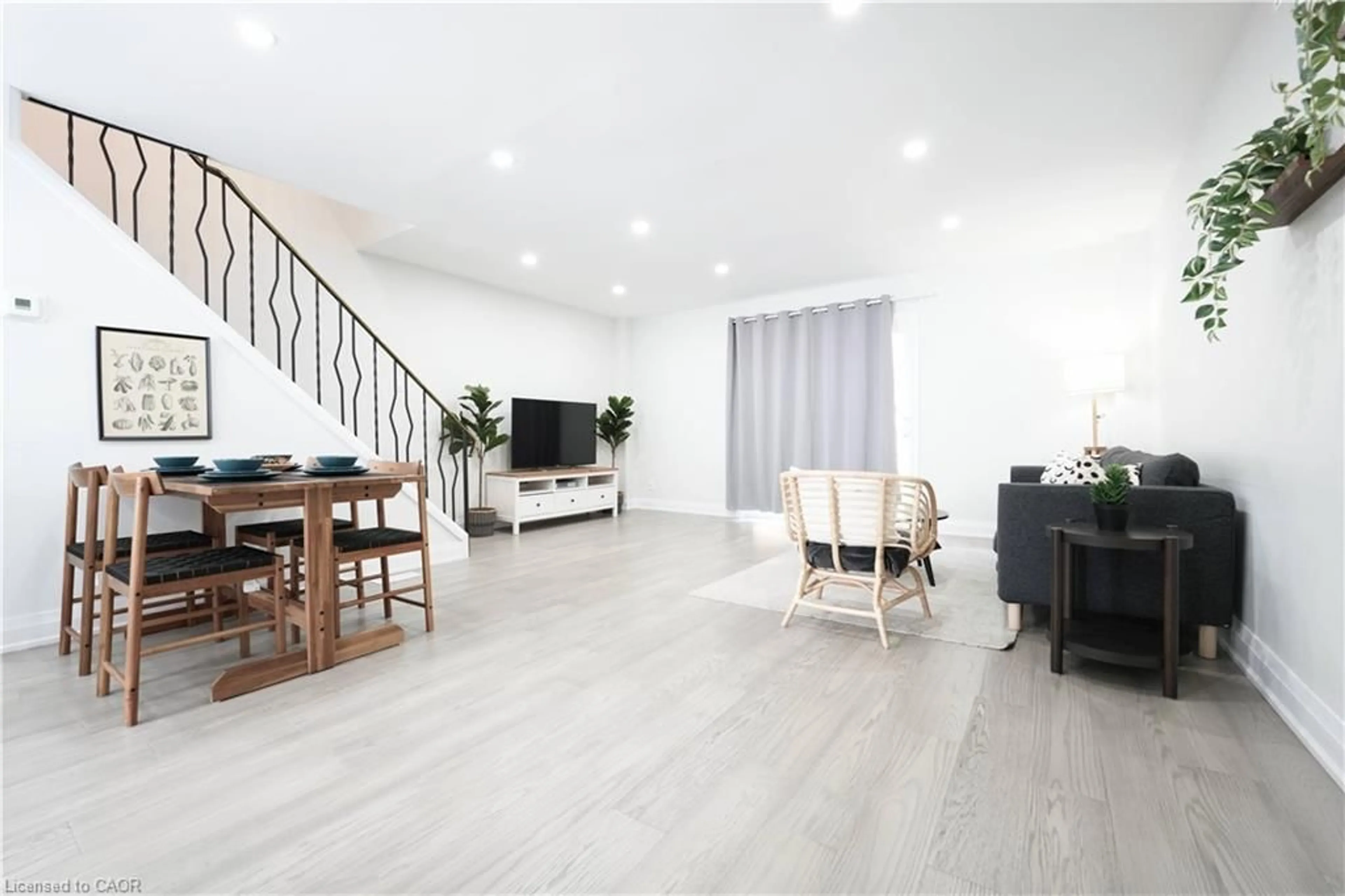 Living room with furniture, wood/laminate floor for 136 Jansen Ave, Kitchener Ontario N2A 2L7