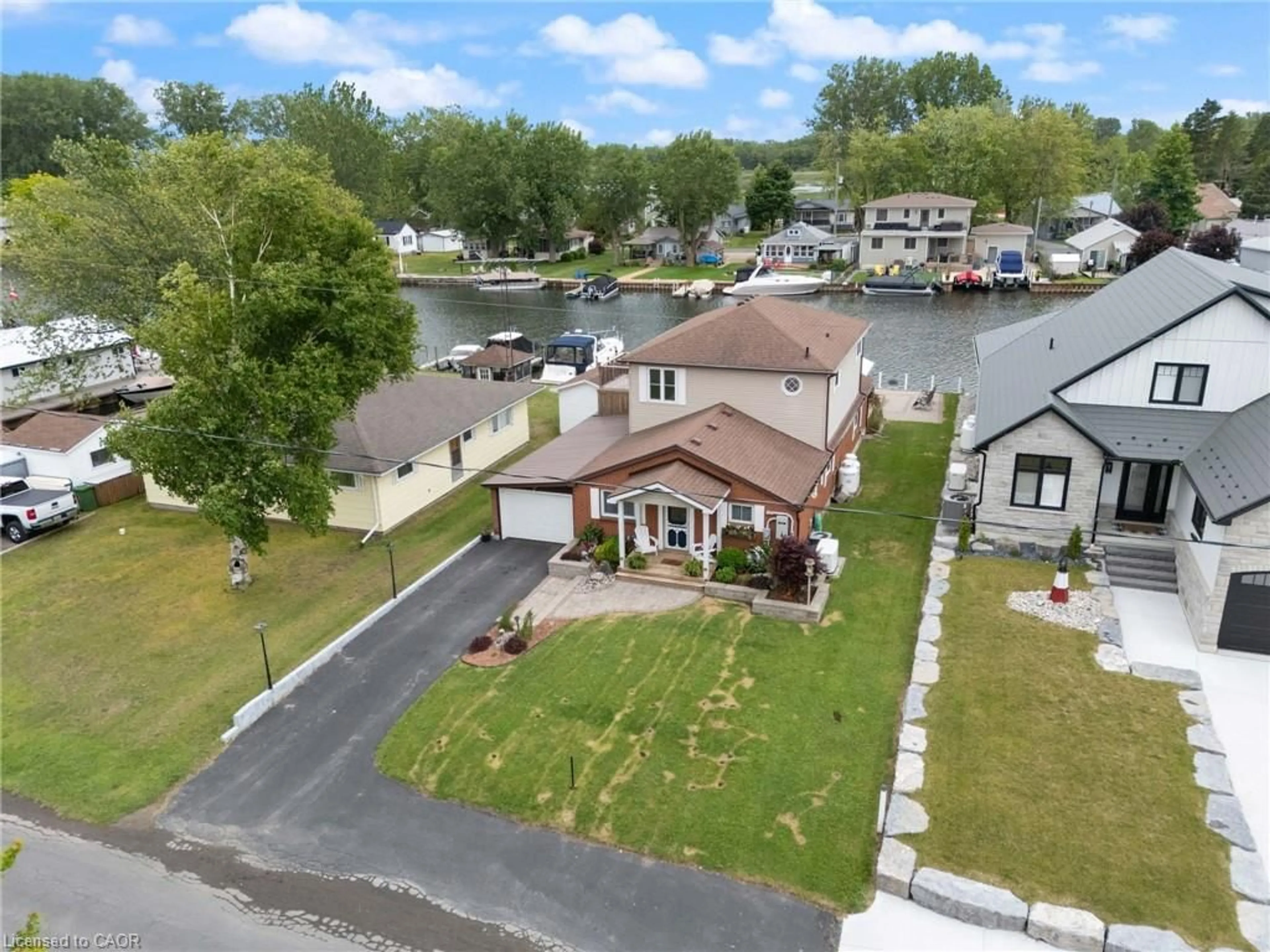 A pic from outside/outdoor area/front of a property/back of a property/a pic from drone, water/lake/river/ocean view for 13 Rogers Ave, Long Point Ontario N0E 1M0