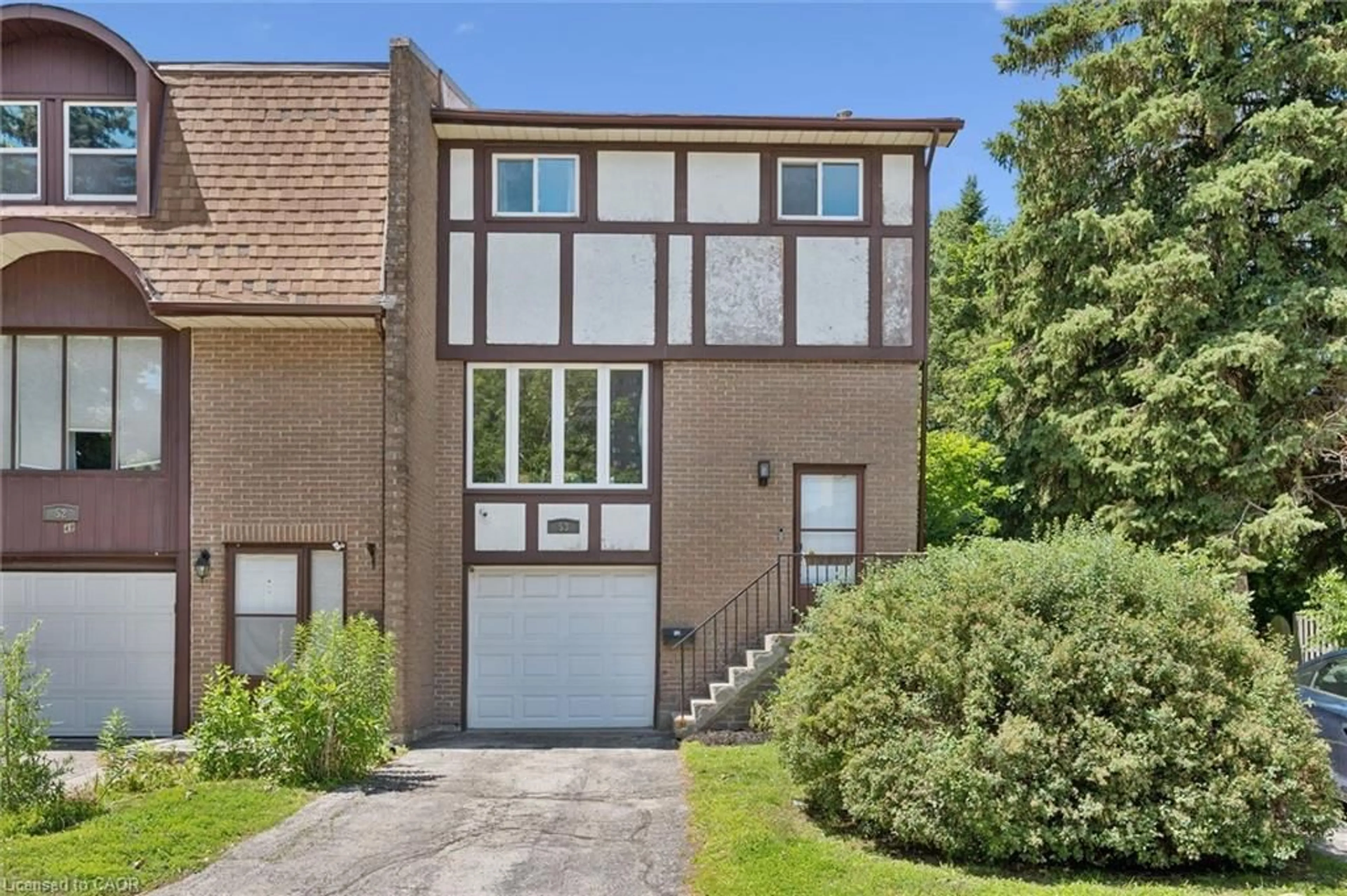Home with brick exterior material, street for 49 Cedarwoods Cres #53, Kitchener Ontario N2C 2L1