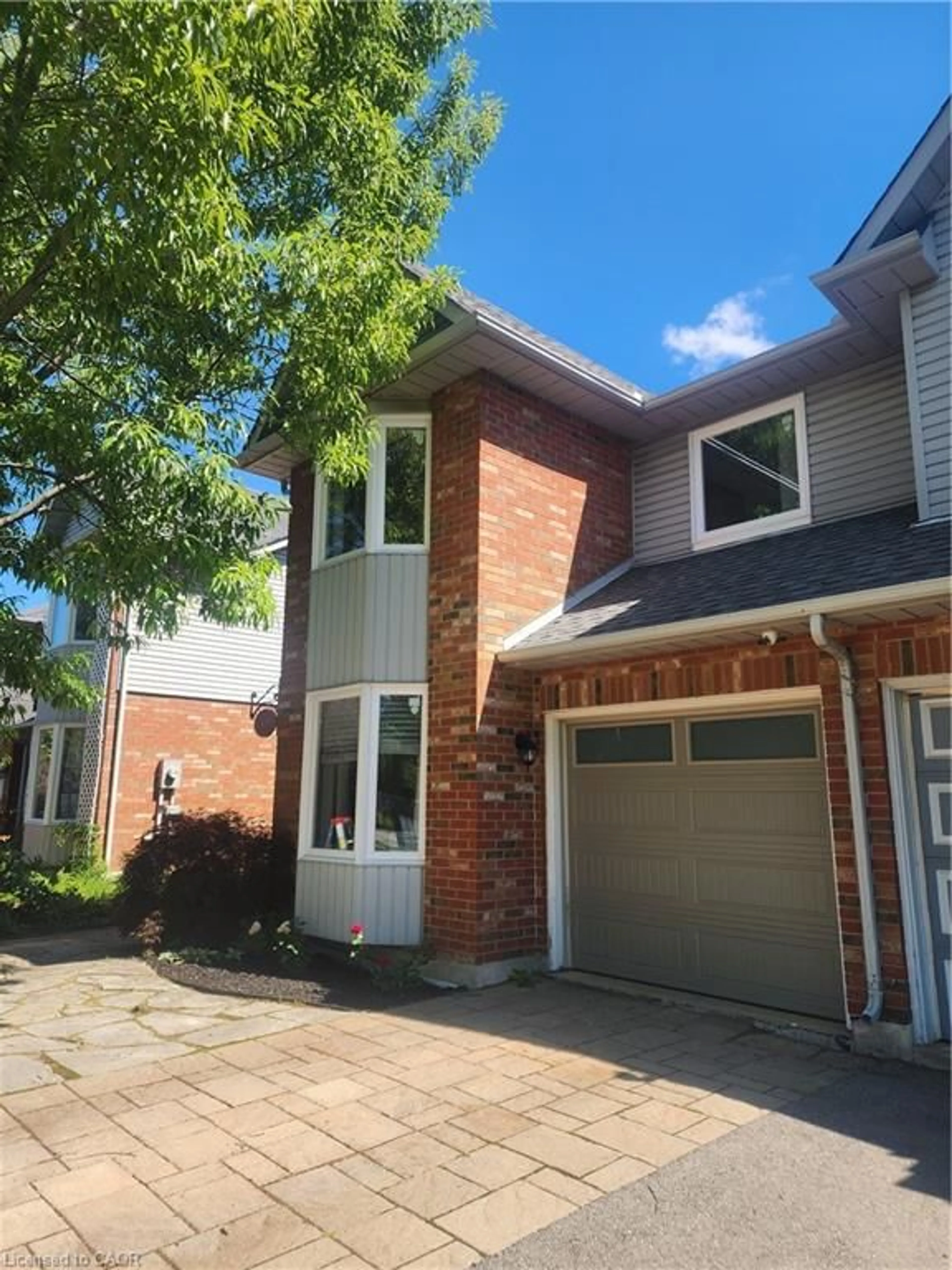 Home with brick exterior material, street for 1305 Walker's Line, Burlington Ontario L7M 4N7