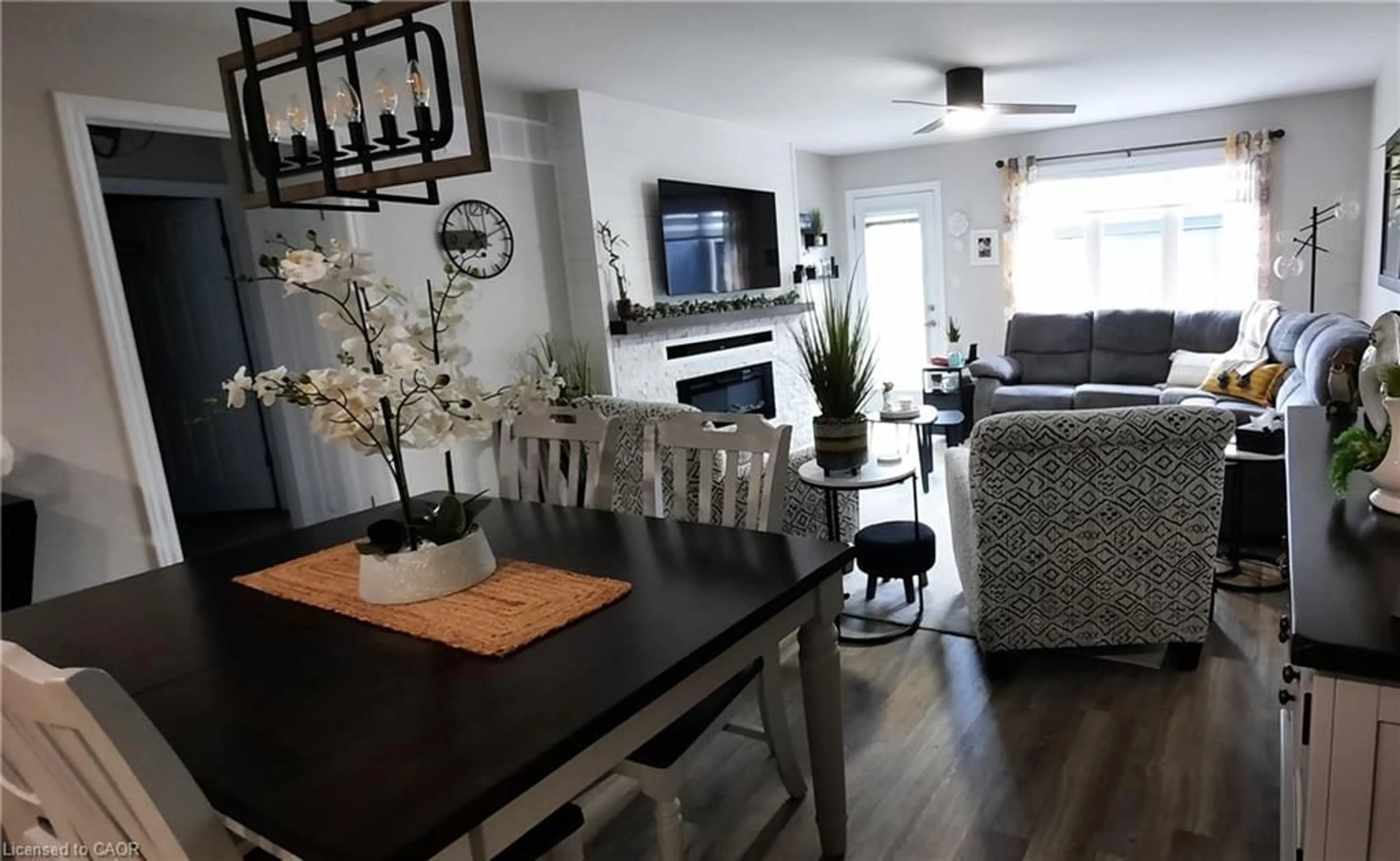 Living room with furniture, wood/laminate floor for 1502 Caen Ave, Woodstock Ontario N4T 0J8