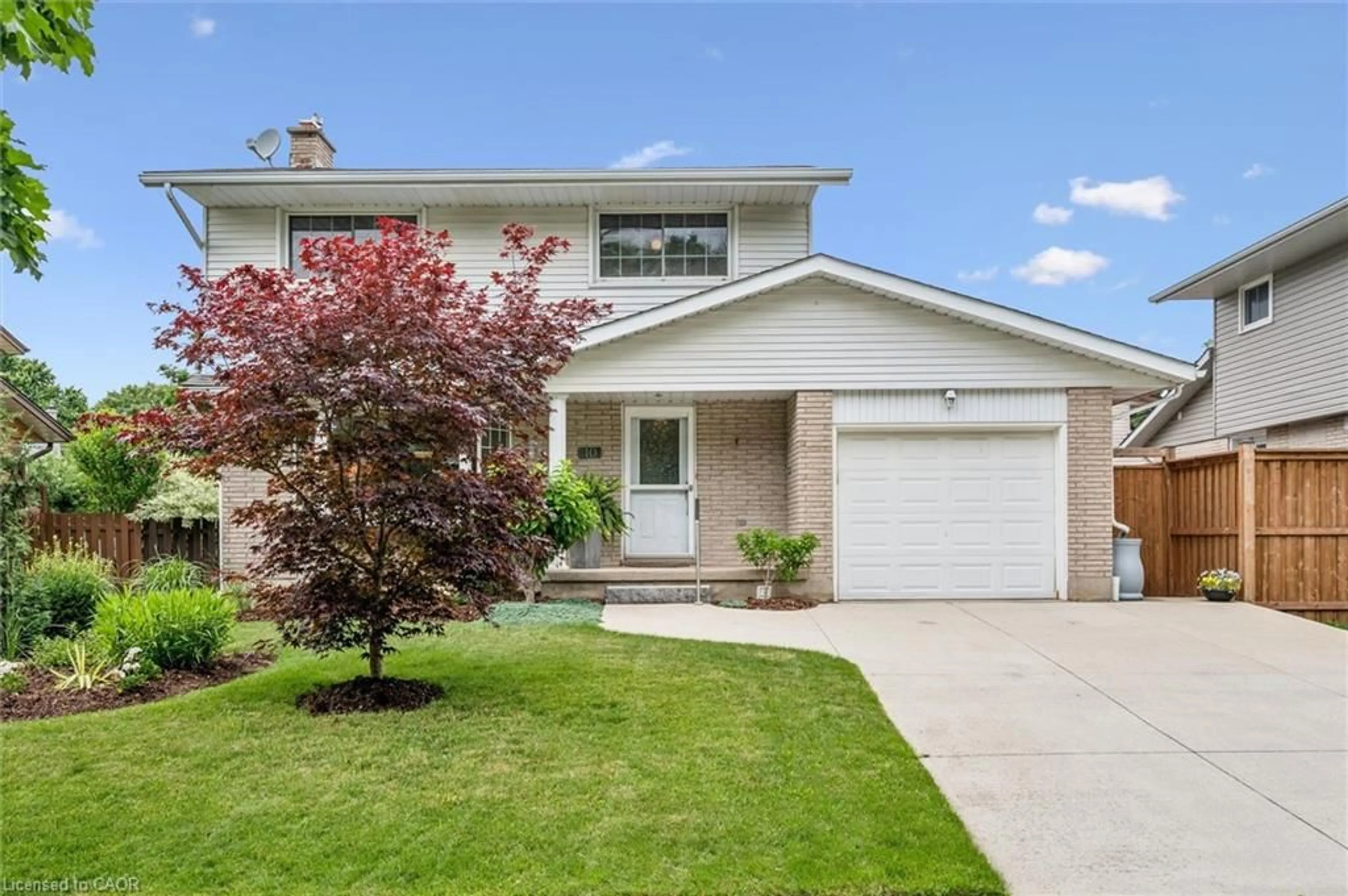 Home with vinyl exterior material, street for 10 Radcliffe Dr, Kitchener Ontario N2E 2H3