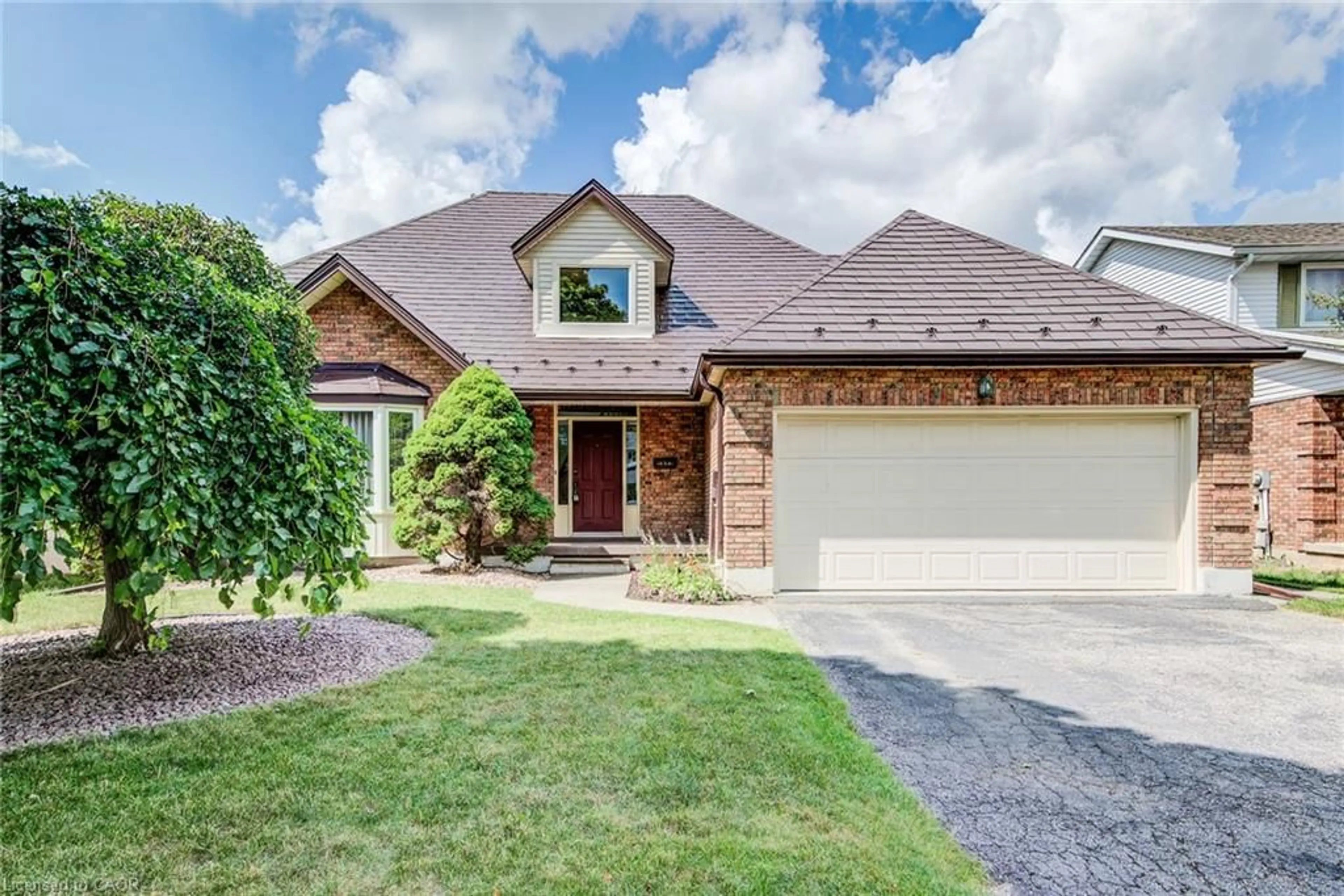Home with brick exterior material, street for 323 Auburn Dr, Waterloo Ontario N2K 3E1