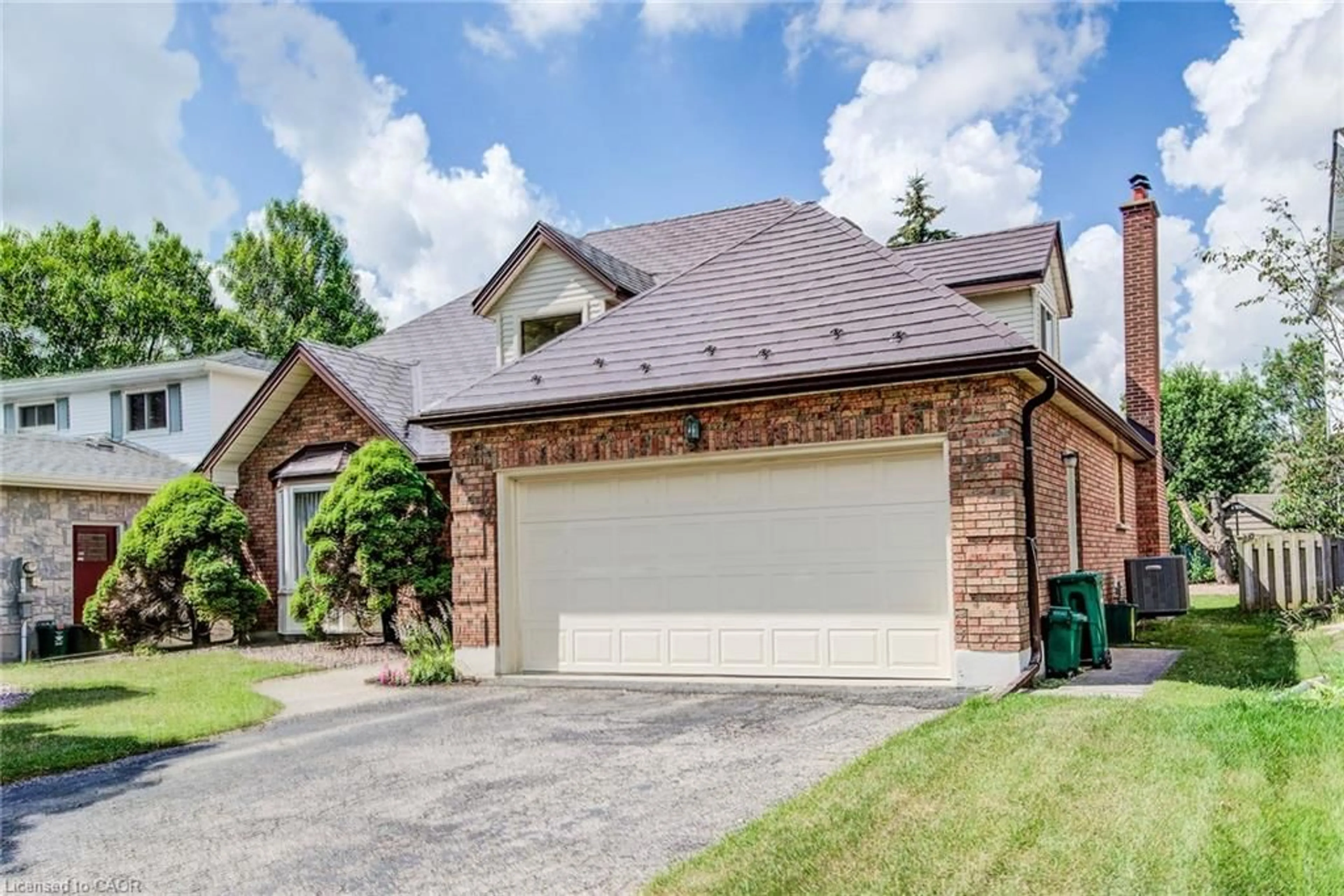 Home with brick exterior material, street for 323 Auburn Dr, Waterloo Ontario N2K 3E1