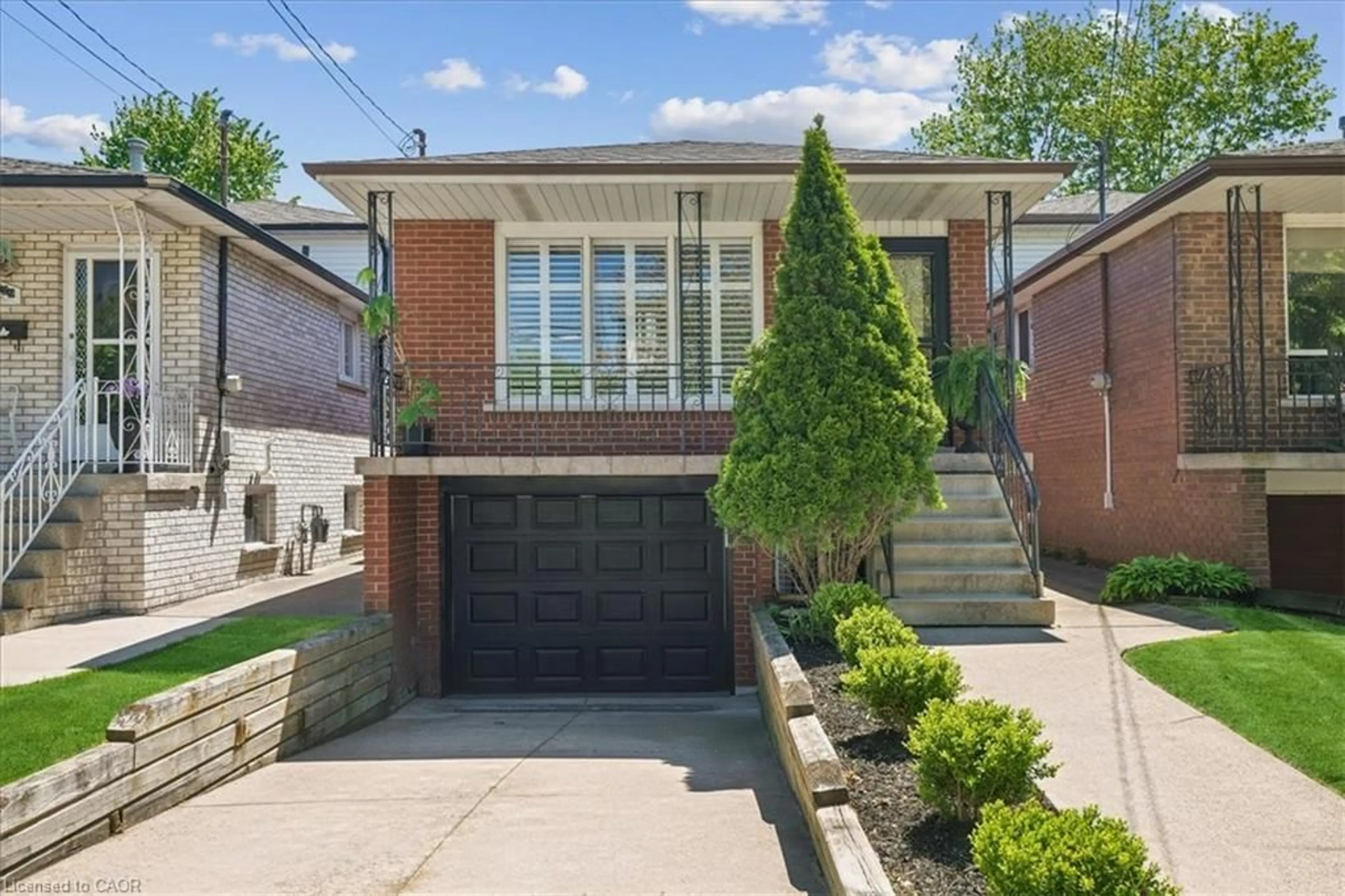 Home with brick exterior material, street for 233 East 8th St, Hamilton Ontario L9A 3L7