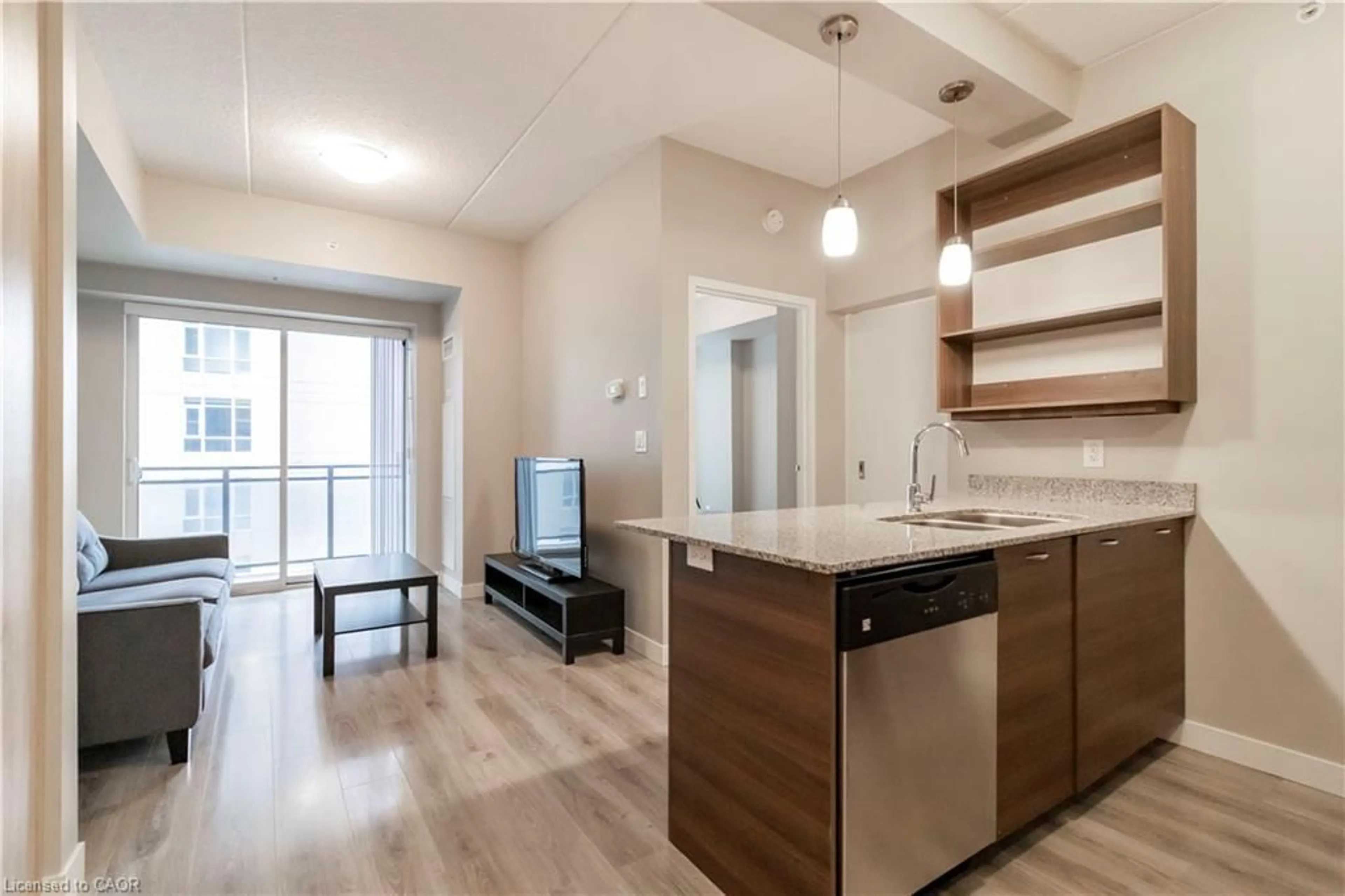 Open concept kitchen, wood/laminate floor for 318 Spruce St #1004, Waterloo Ontario N2L 0E9