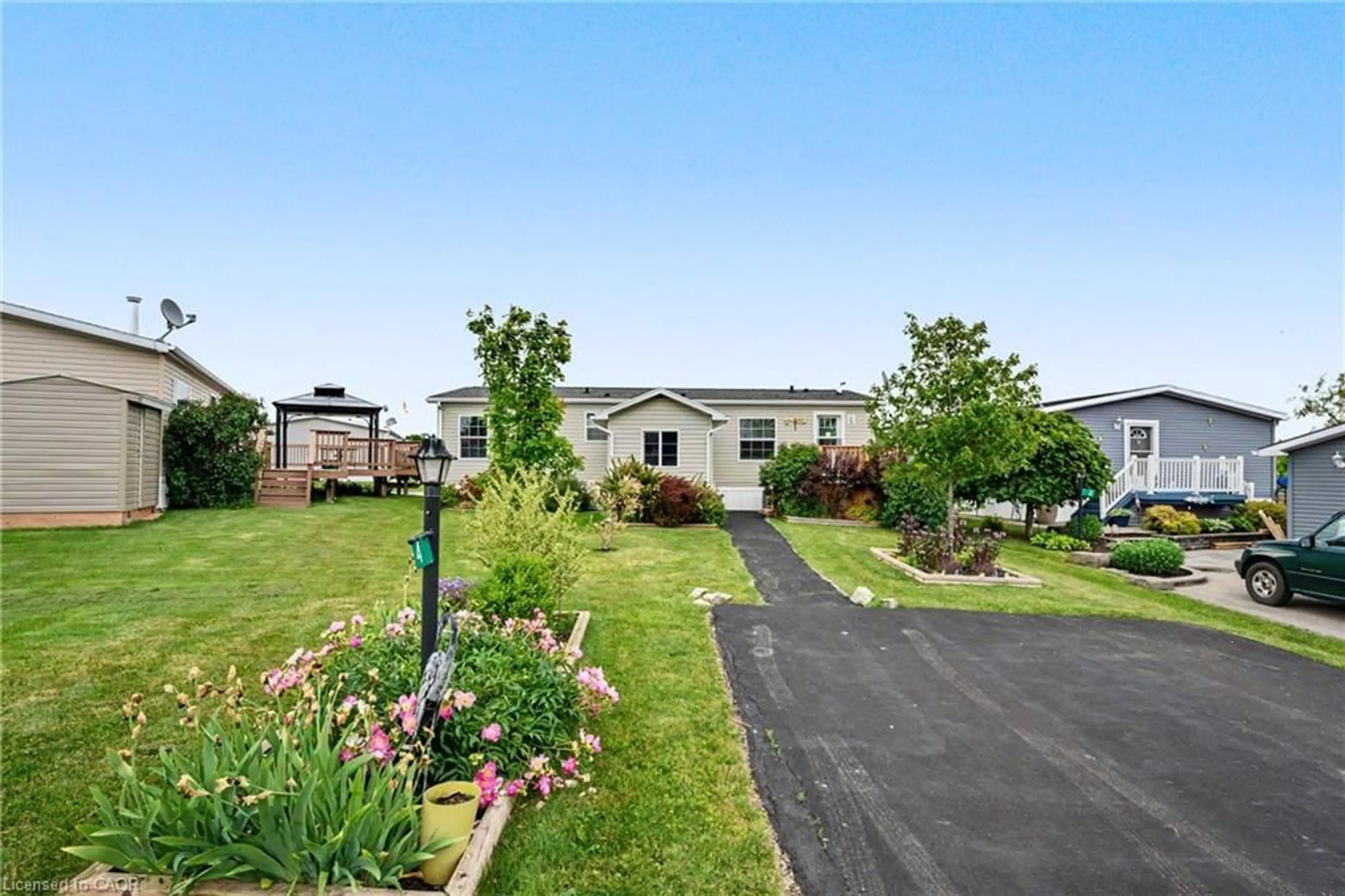 A pic from outside/outdoor area/front of a property/back of a property/a pic from drone, water/lake/river/ocean view for 4 Hickory Hollow, Nanticoke Ontario N0A 1P0
