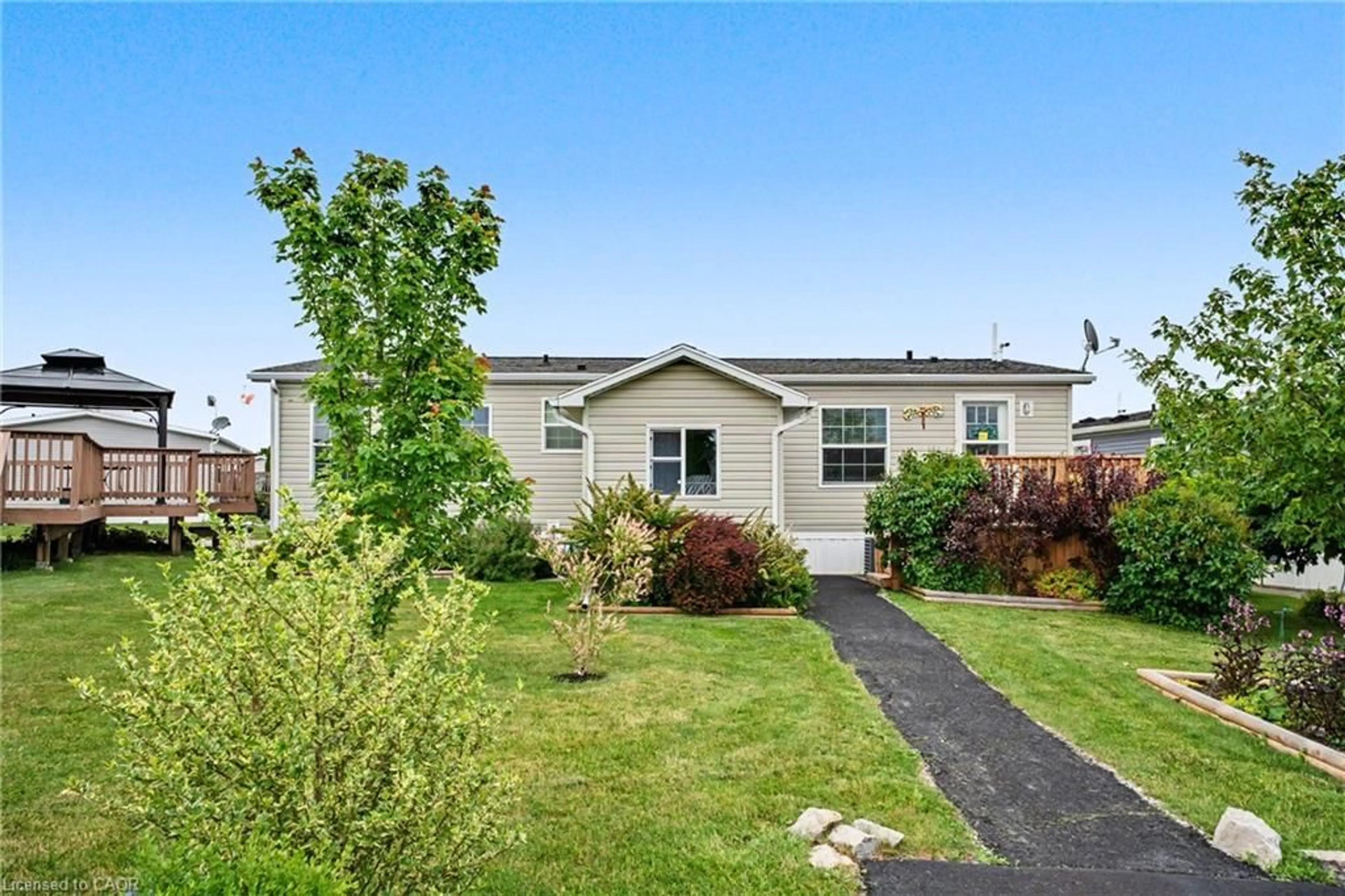 Home with vinyl exterior material, street for 4 Hickory Hollow, Nanticoke Ontario N0A 1P0