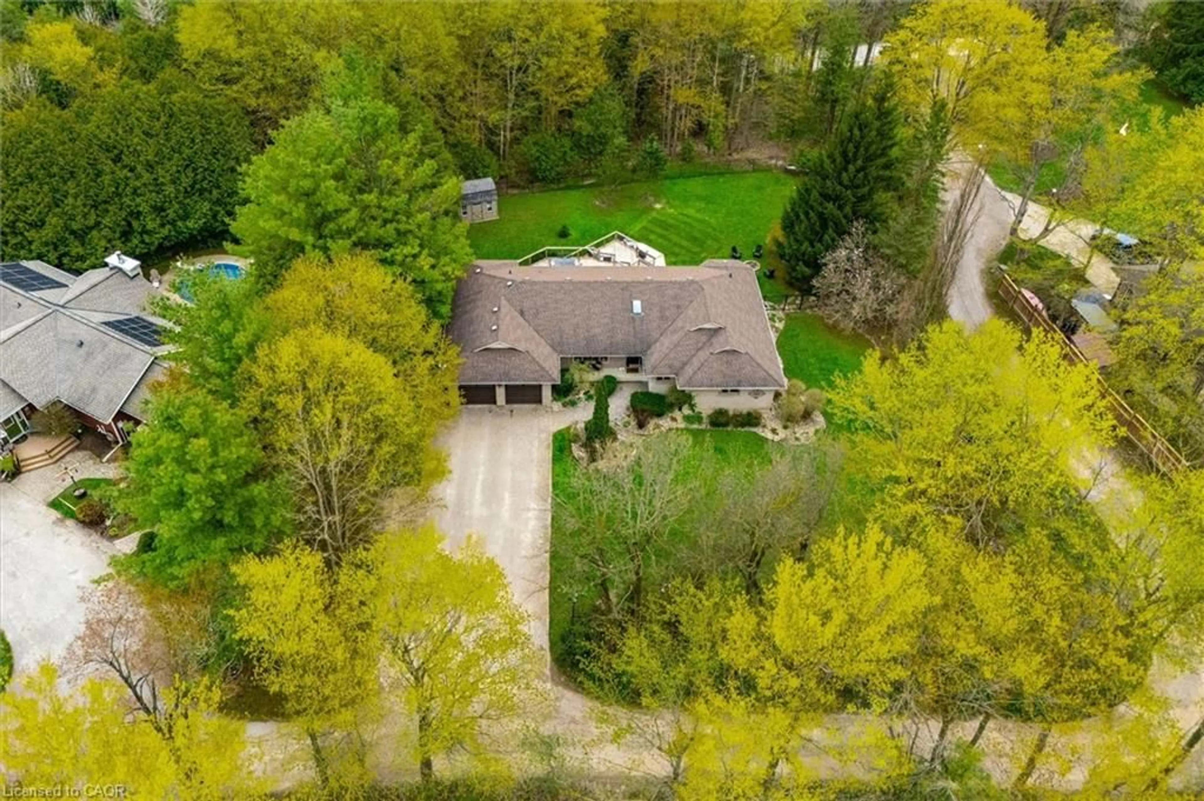 A pic from outside/outdoor area/front of a property/back of a property/a pic from drone, forest/trees view for 25 Riverview Dr, Elora Ontario N0B 1S0