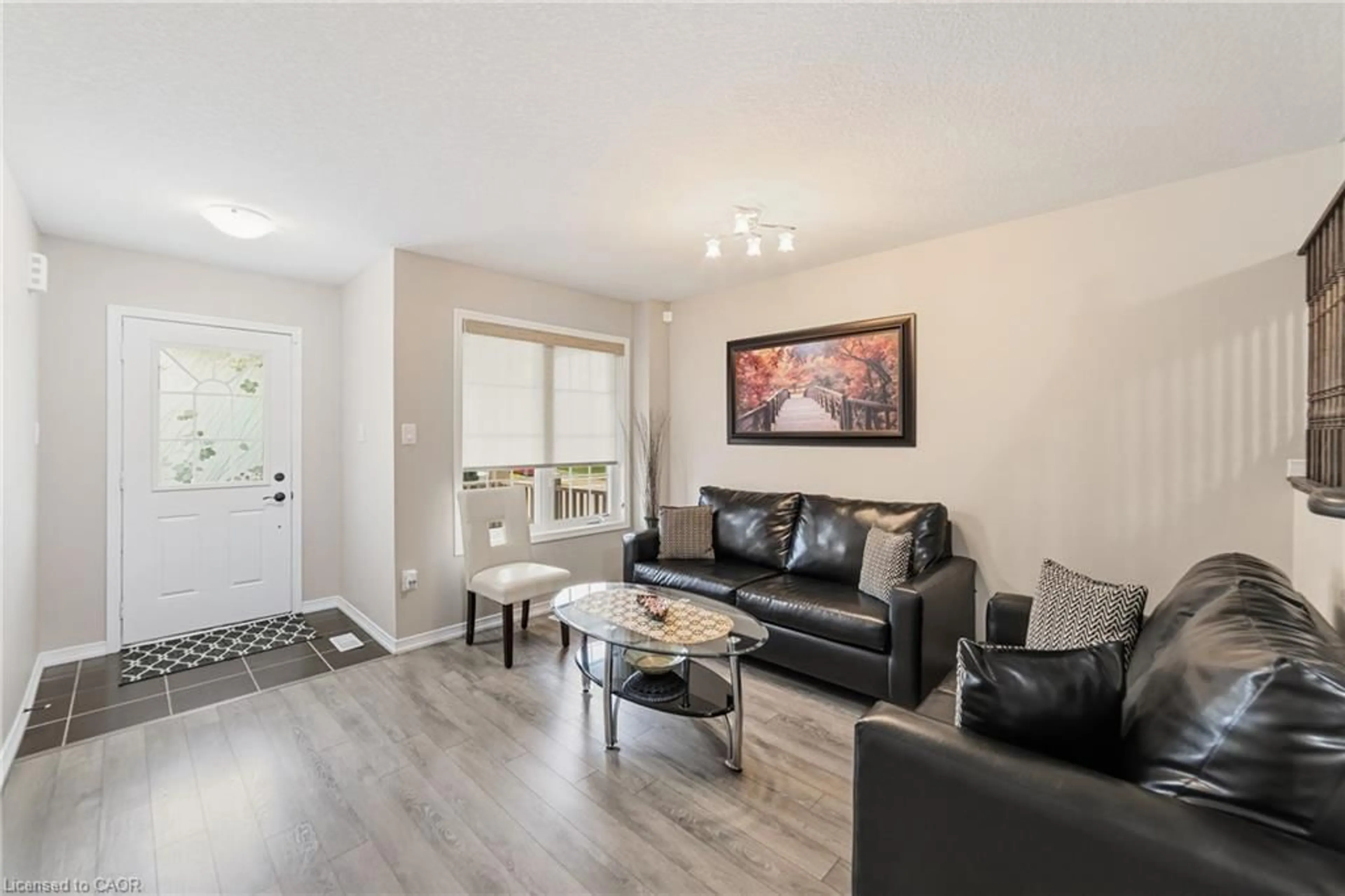 Living room with furniture, wood/laminate floor for 98 Warner Lane, Brantford Ontario N3T 0J3