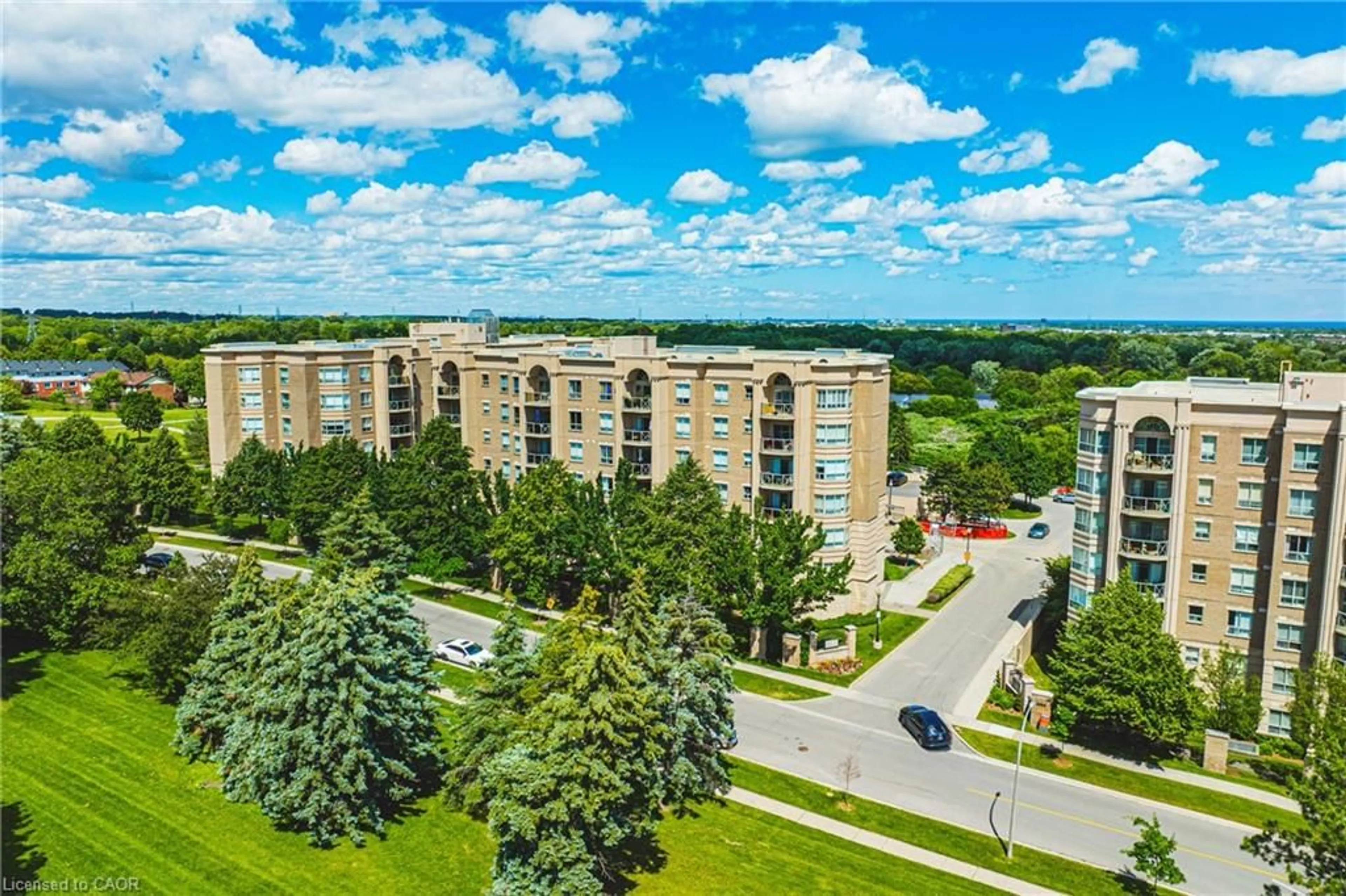 A pic from outside/outdoor area/front of a property/back of a property/a pic from drone, city buildings view from balcony for 2075 Amherst Heights Dr #103, Burlington Ontario L7P 5B8