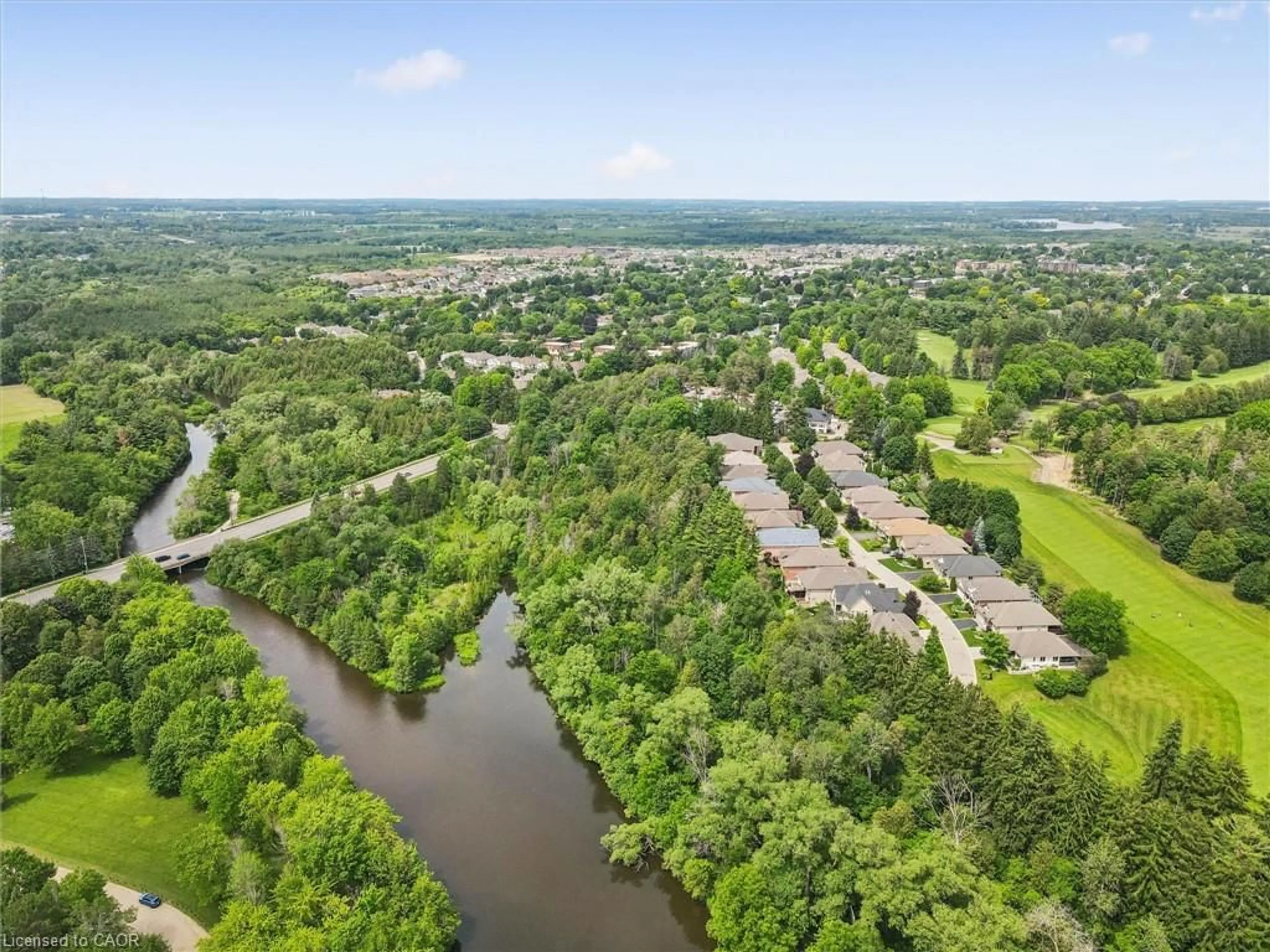 A pic from outside/outdoor area/front of a property/back of a property/a pic from drone, water/lake/river/ocean view for 17 Fairway Lane, Guelph Ontario N1E 7A8