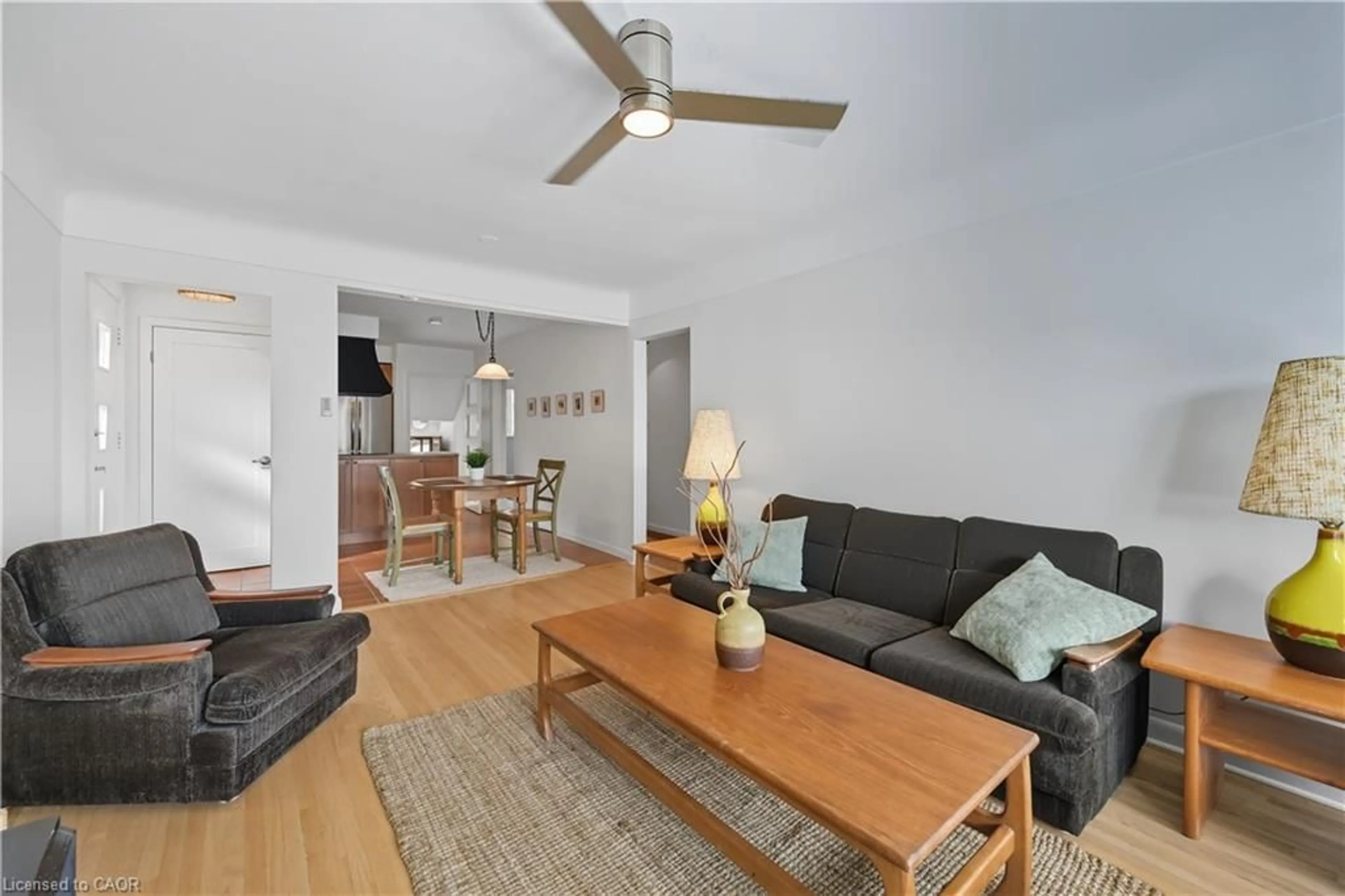 Living room with furniture, wood/laminate floor for 23 Percy Crt, Hamilton Ontario L8T 1W7