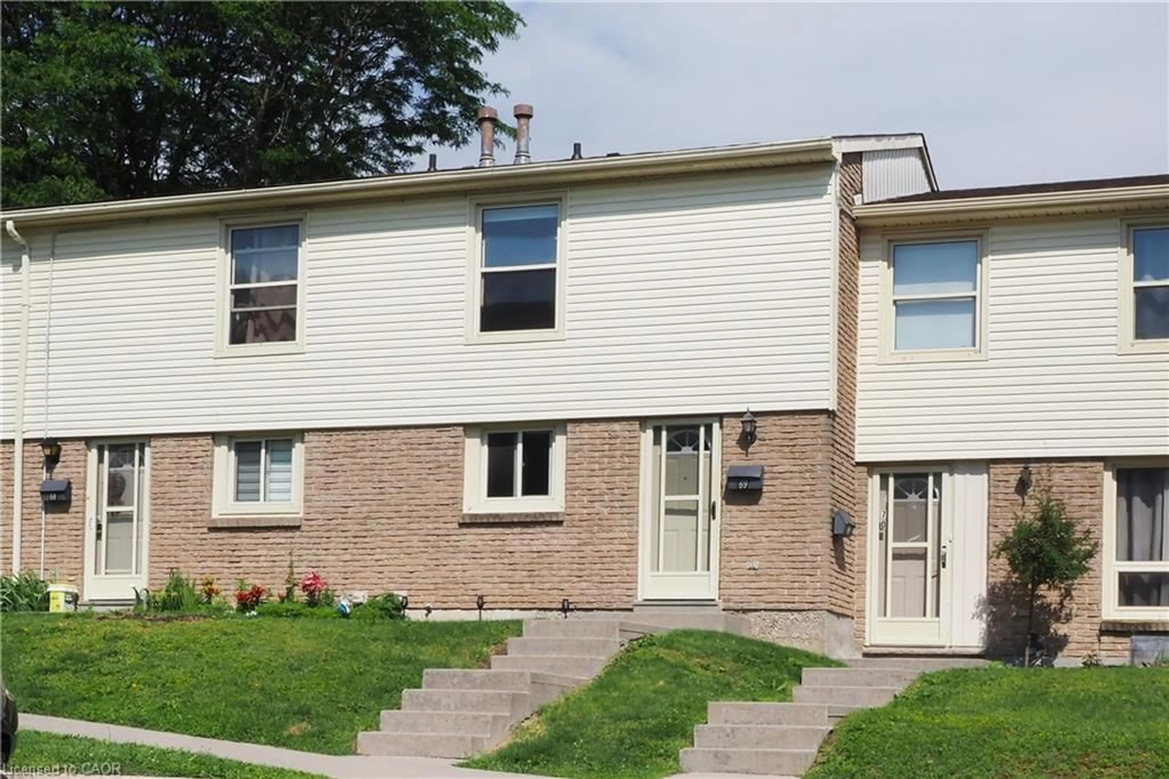 Home with brick exterior material, street for 165 Green Valley Dr #69, Kitchener Ontario N2P 1K3
