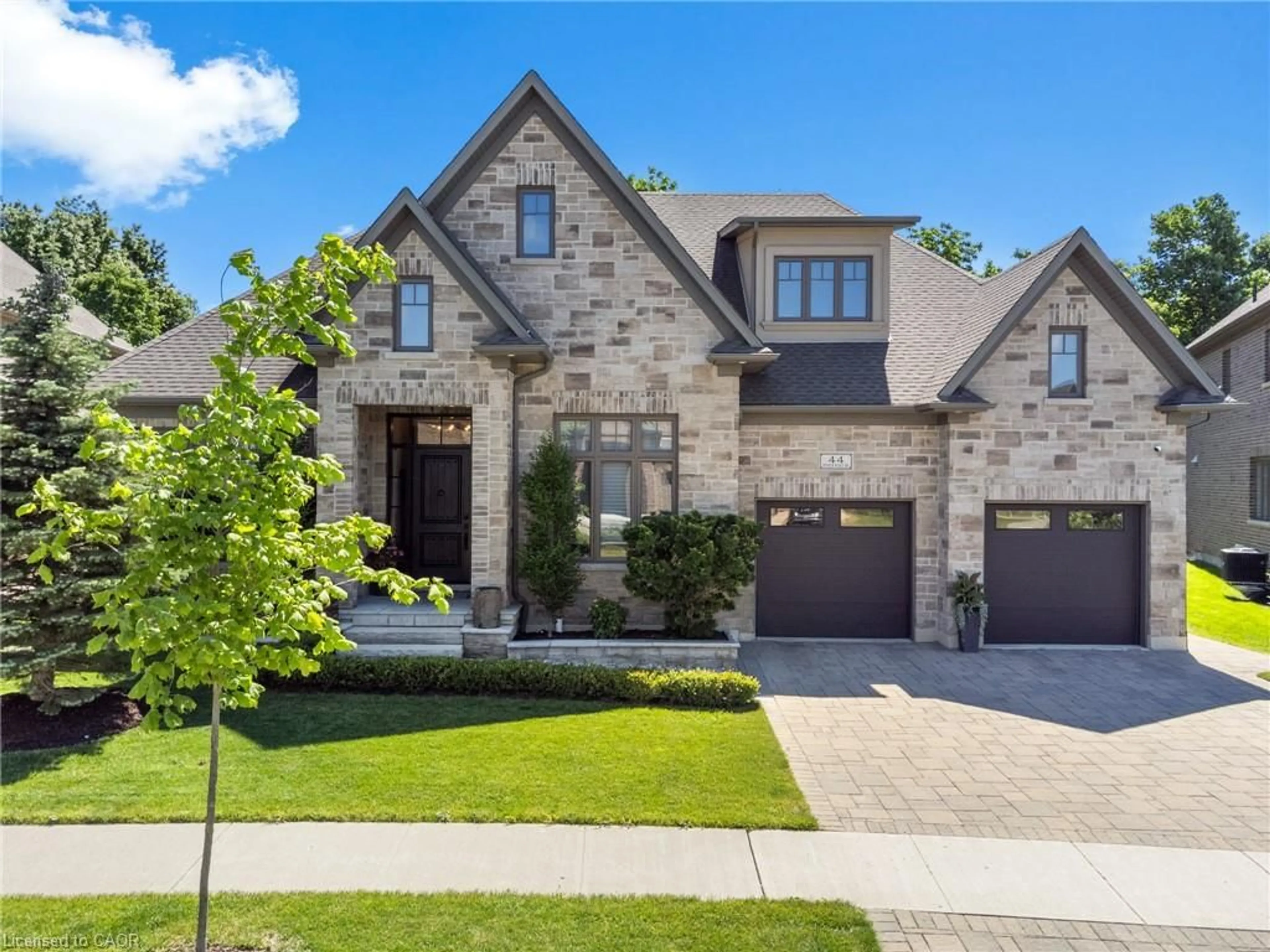 Home with brick exterior material, street for 44 Pioneer Ridge Dr, Kitchener Ontario N2P 0G6