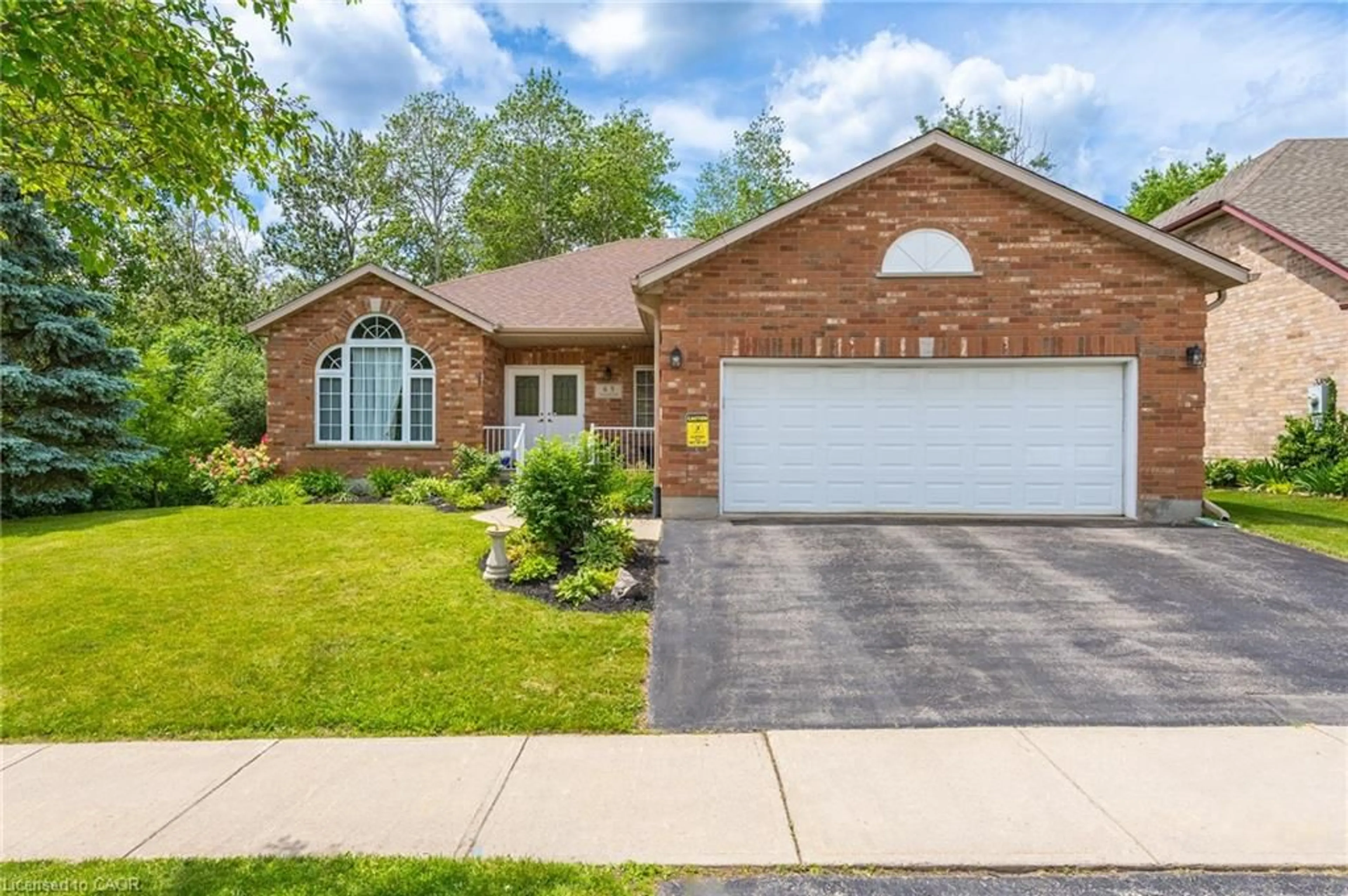 Home with brick exterior material, street for 63 Daimler Dr, Kitchener Ontario N2A 3W3
