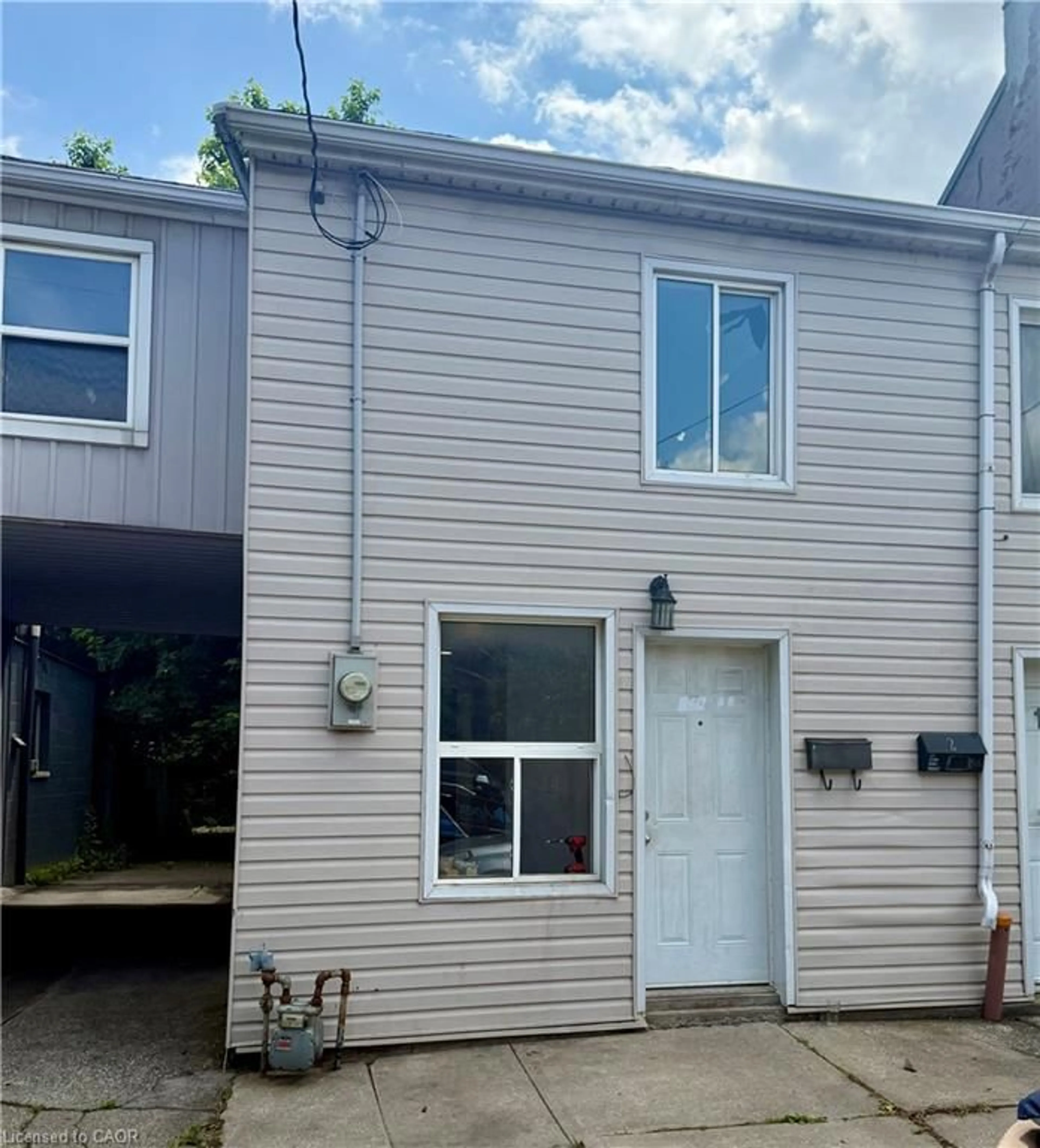 Home with vinyl exterior material, street for 170 1/2 Macnab St, Hamilton Ontario L8R 2M4