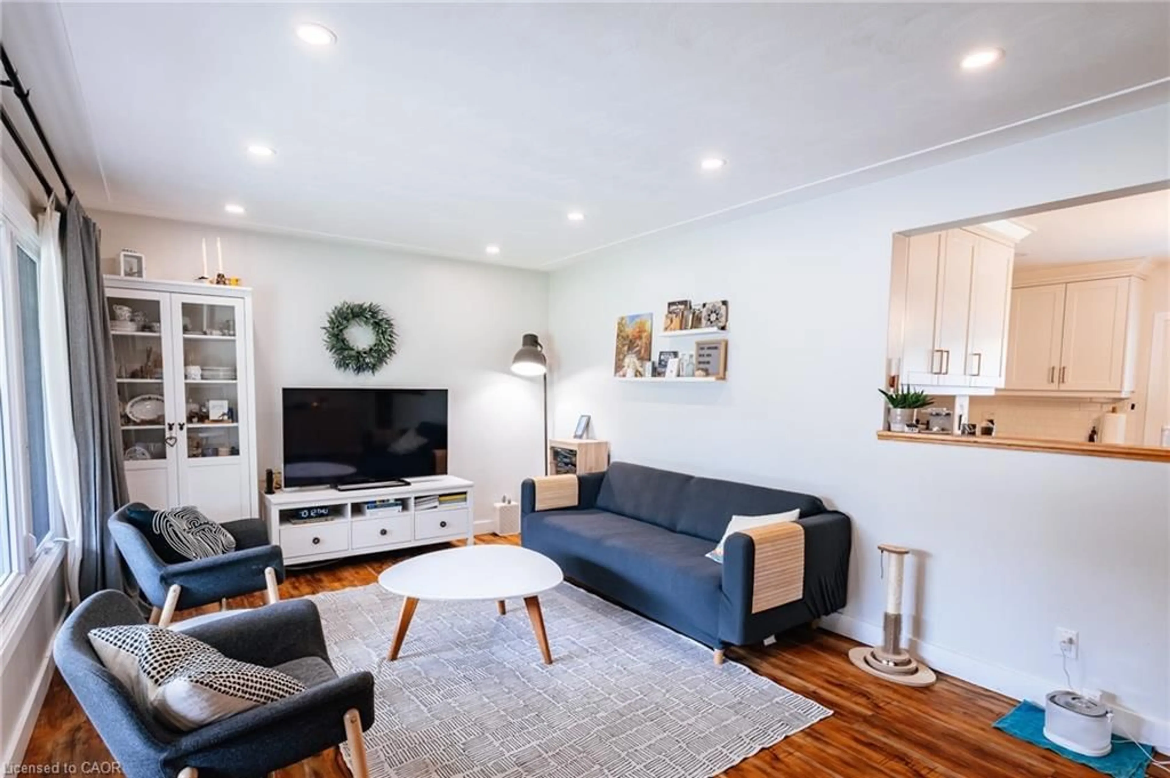 Living room with furniture, wood/laminate floor for 217 Dixon St, Kitchener Ontario N2G 3E8