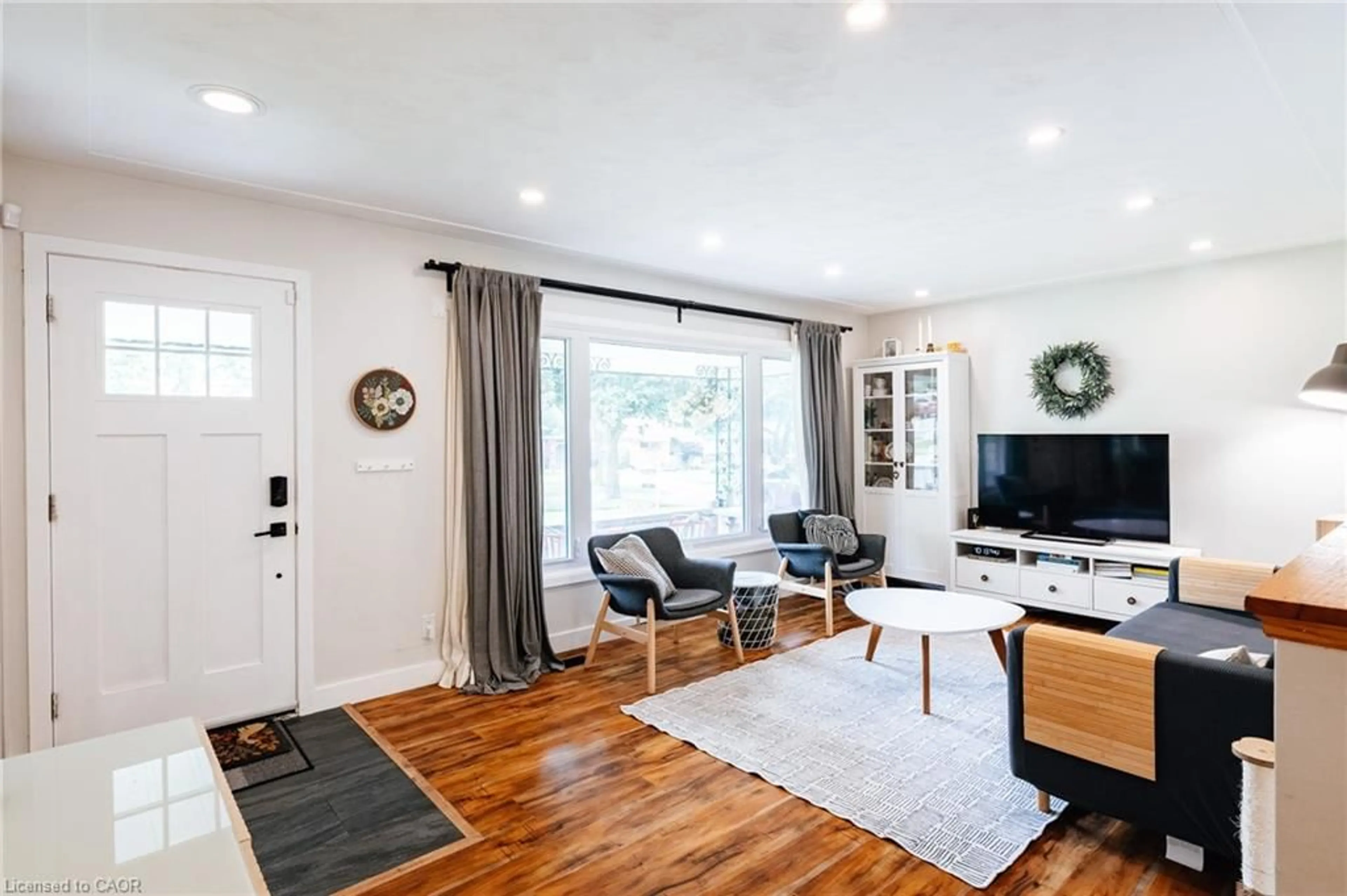 Living room with furniture, wood/laminate floor for 217 Dixon St, Kitchener Ontario N2G 3E8