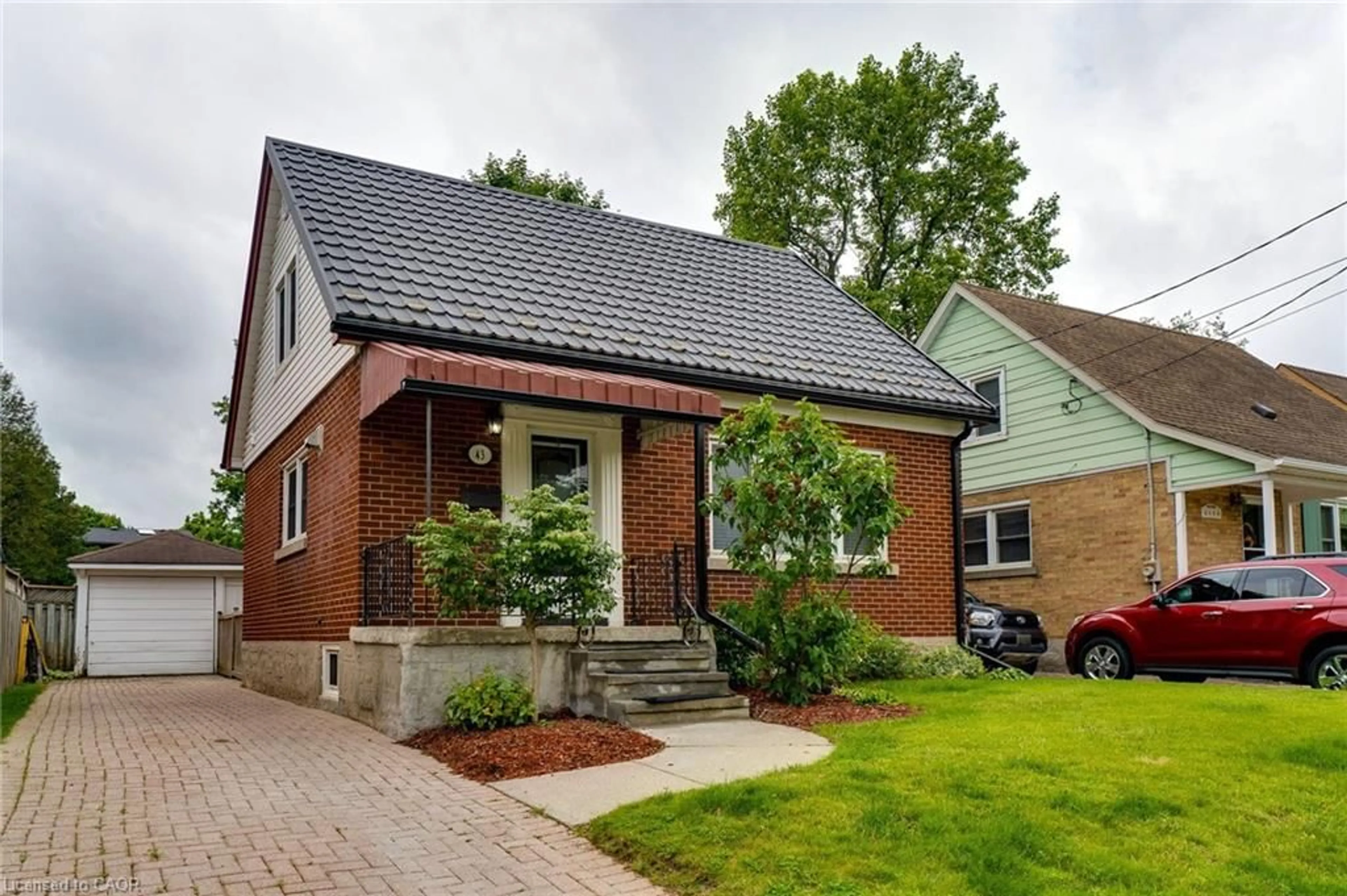 Home with brick exterior material, street for 43 Brick St, Kitchener Ontario N2H 3L2