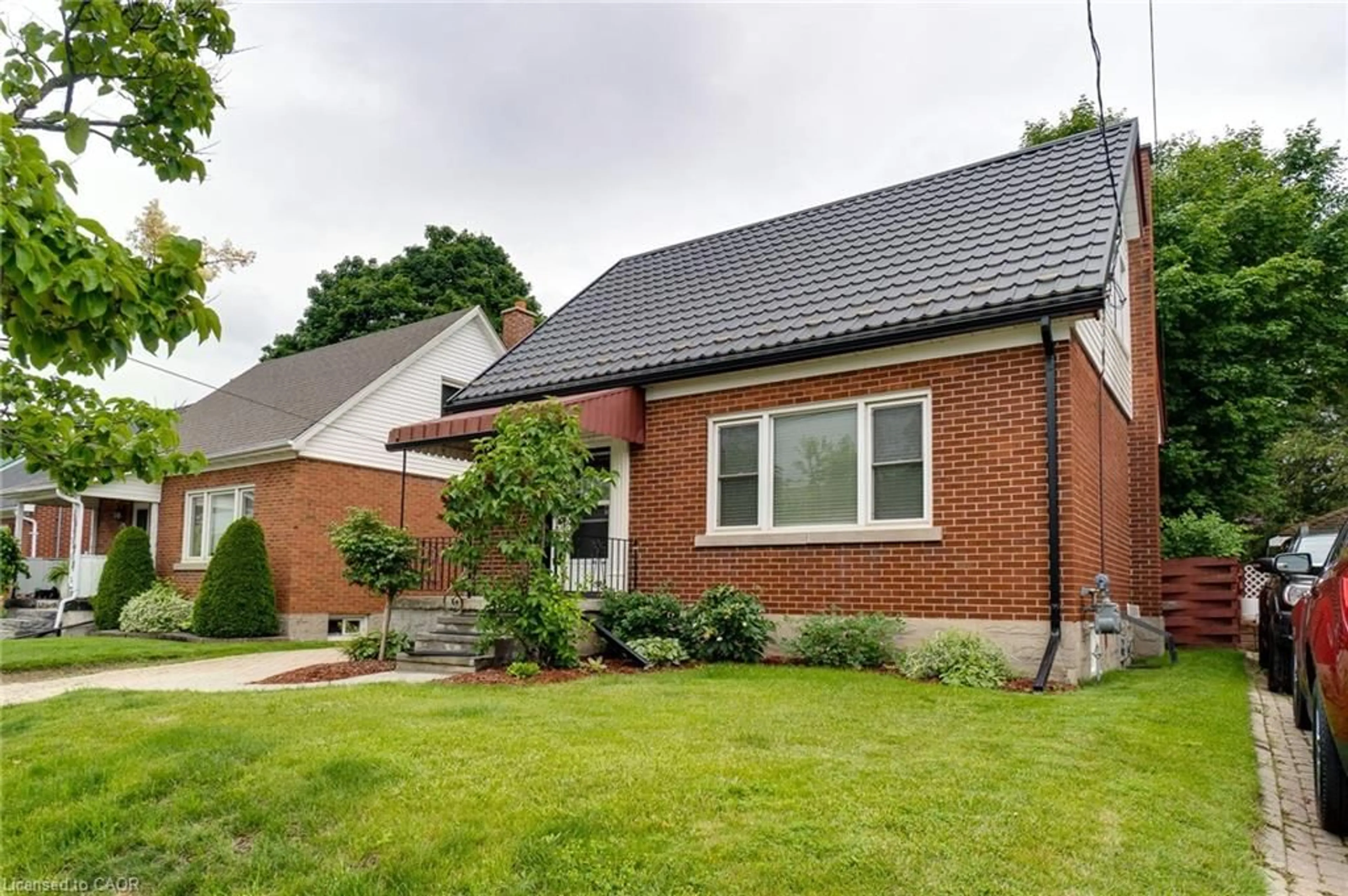 Home with brick exterior material, street for 43 Brick St, Kitchener Ontario N2H 3L2