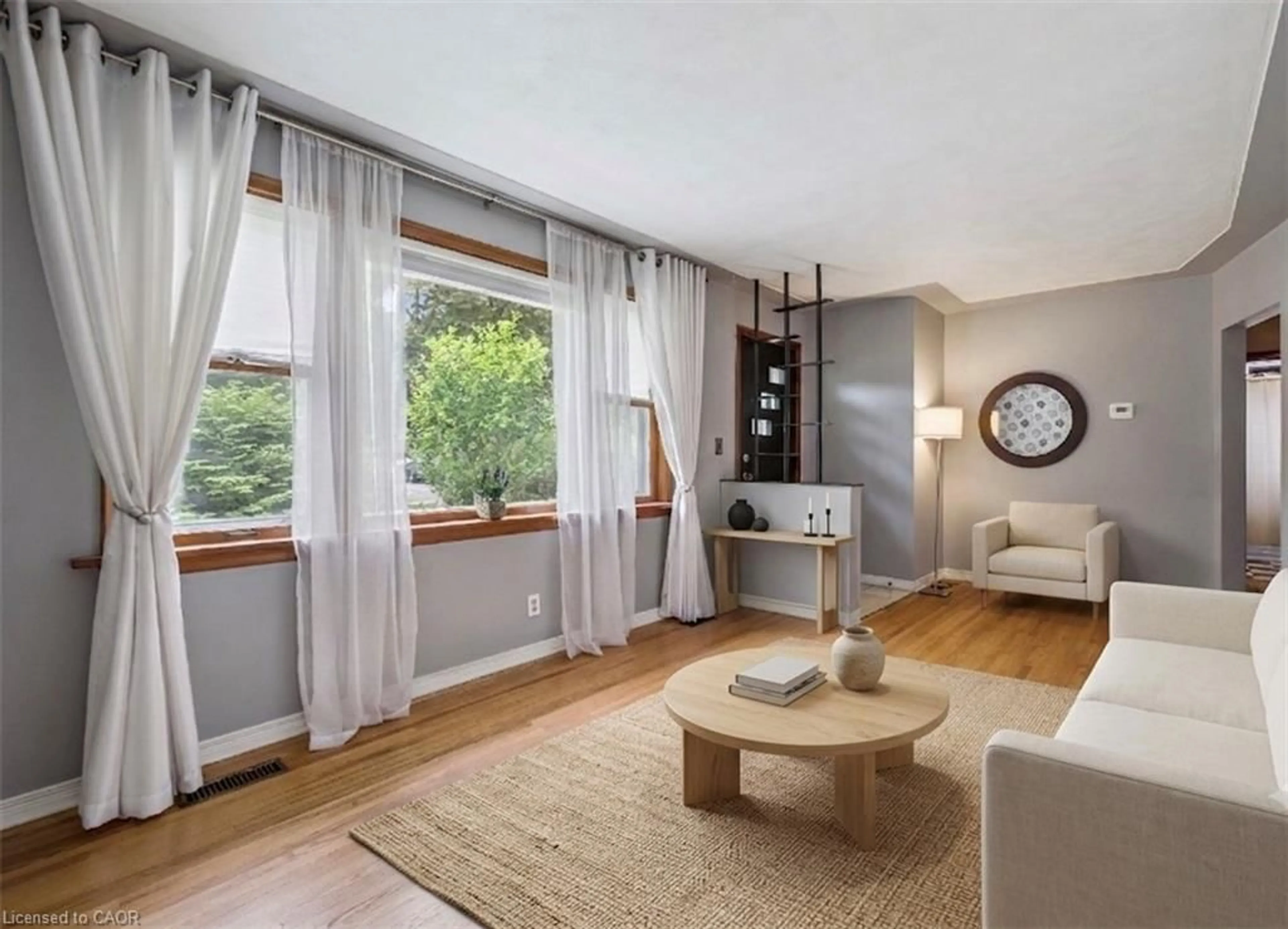 Living room with furniture, wood/laminate floor for 87 Cassino Ave, Guelph Ontario N1E 2J4