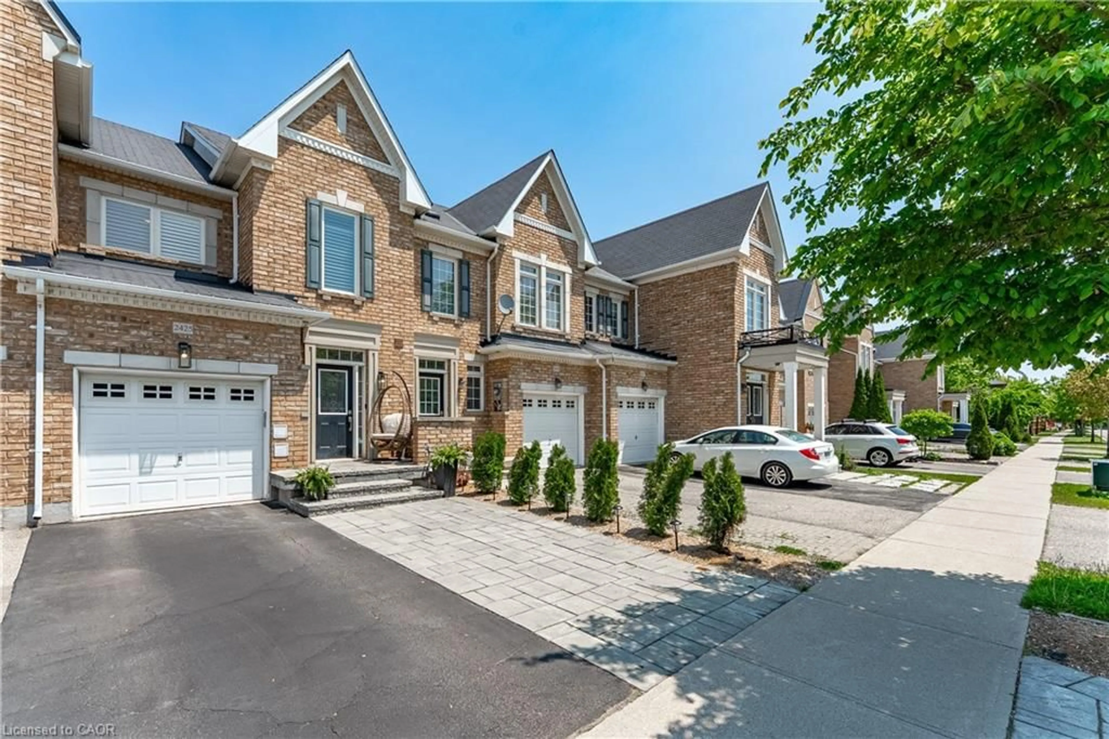 Home with brick exterior material, street for 2425 Grand Oak Trail, Oakville Ontario L6M 0J4