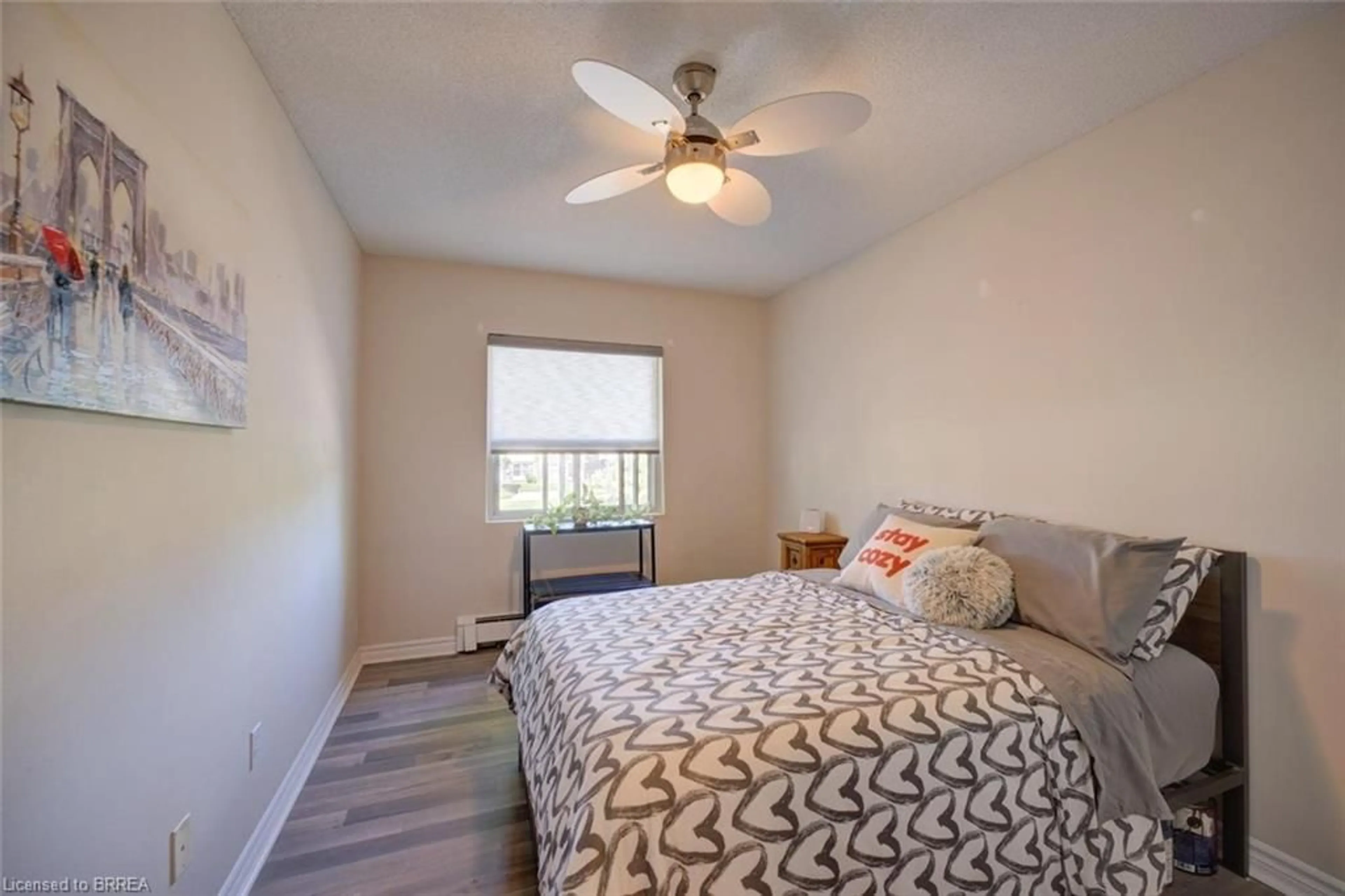 Bedroom with bed, wood/laminate floor for 608 Grey St #18, Brantford Ontario N3S 4Y4
