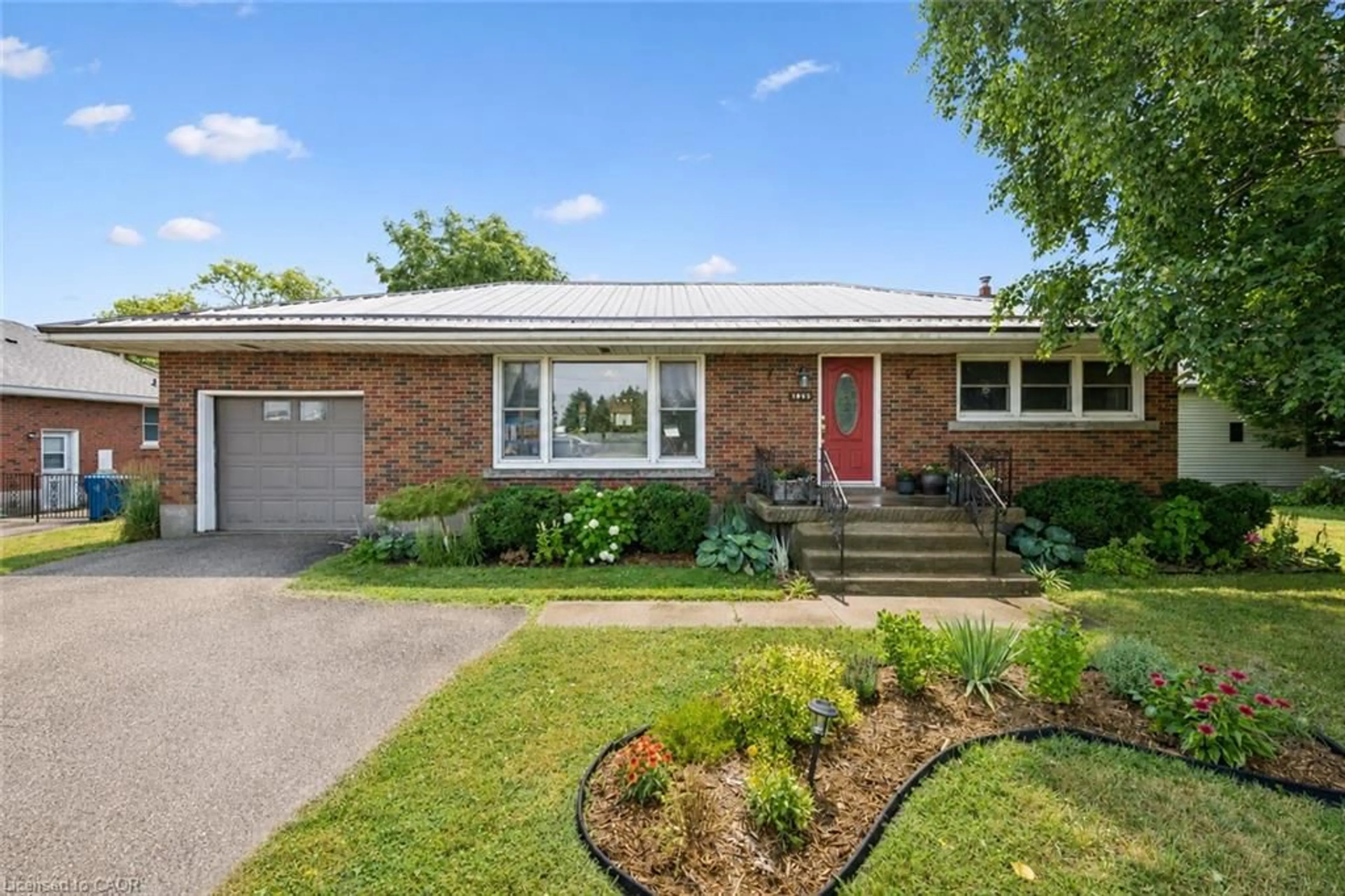 Home with brick exterior material, street for 1065 Erie St, Stratford Ontario N5A 6S4
